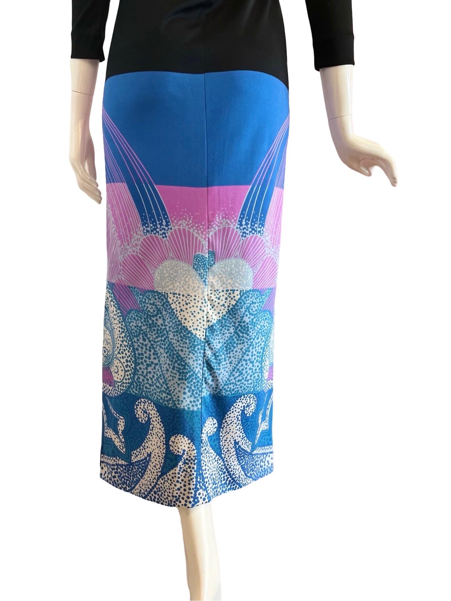 1970s Lanvin in their typical-for-the era polyester jersey fabric in a psychedelic print in lilac and blues of ocean waves. This is a fitted maxi dress with long sleeves and a slit on the left hand side.  It would appear that someone altered this