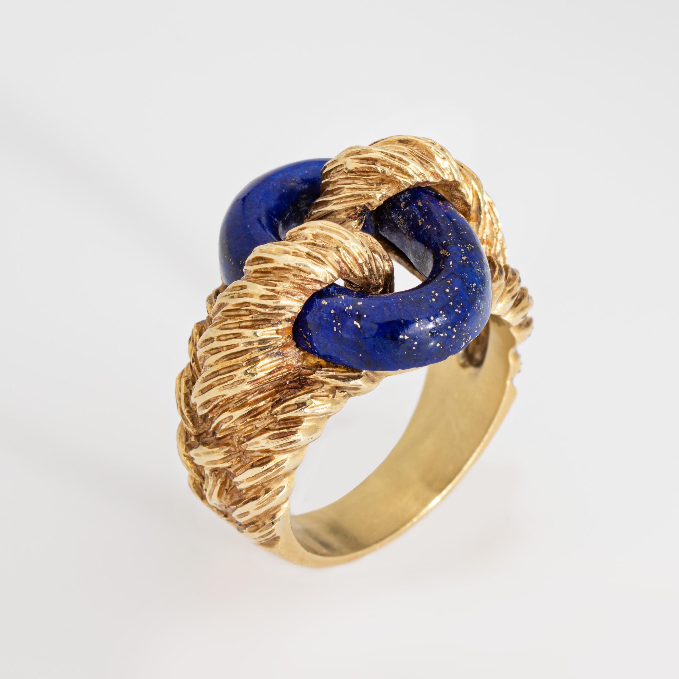 Stylish and finely detailed lapis lazuli ring crafted in 18 karat yellow gold (circa 1970s).

Oval cut lapis lazuli measures 5mm. The lapis is in very good condition and free of cracks or chips. 

Cobalt blue lapis lazuli is oval cut, supported in