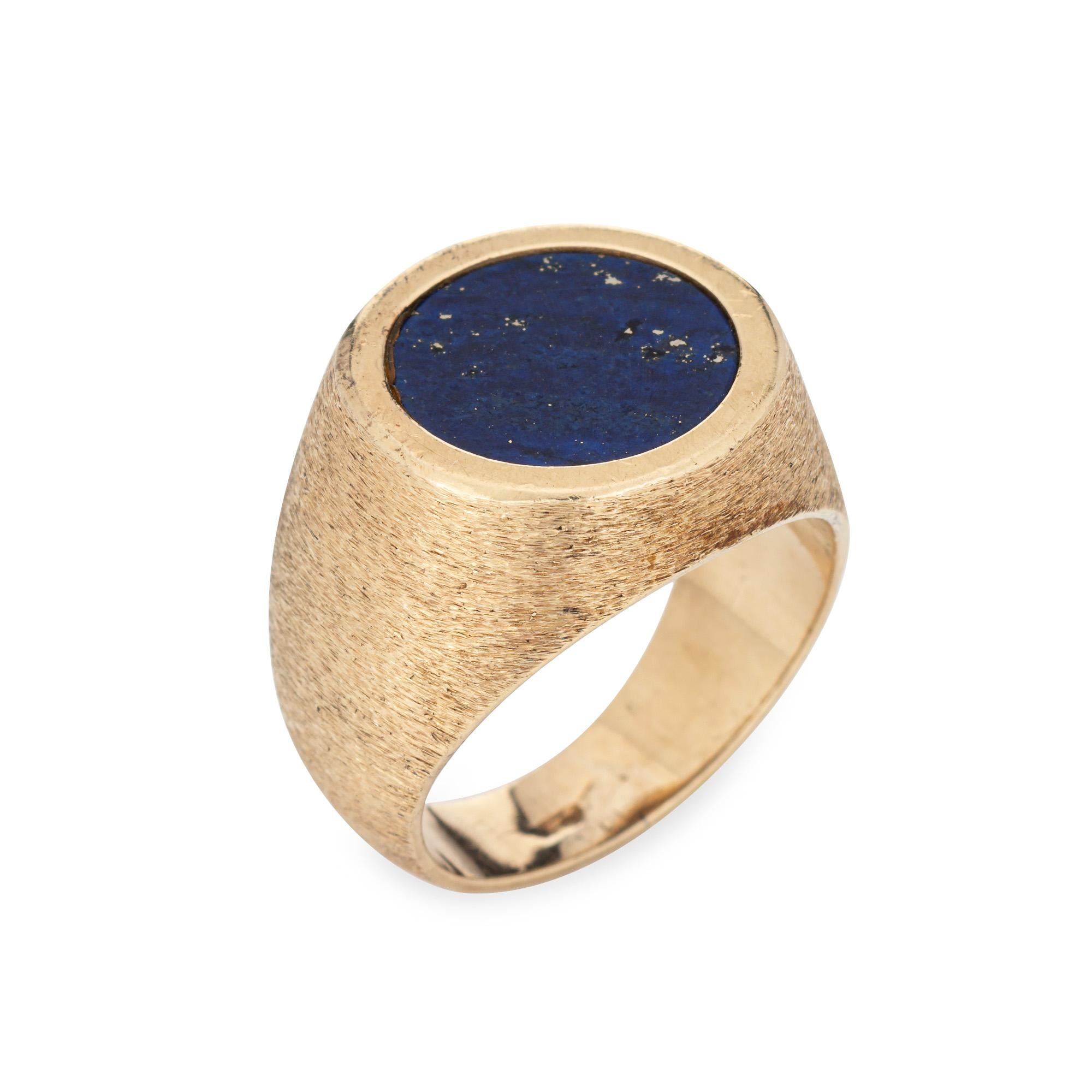 Stylish and finely detailed lapis lazuli signet ring crafted in 14 karat yellow gold (circa 1970s).

Lapis lazuli measures 11mm diameter and is set flush into the mount. The lapis is in very good condition and free of cracks or chips.

The cobalt