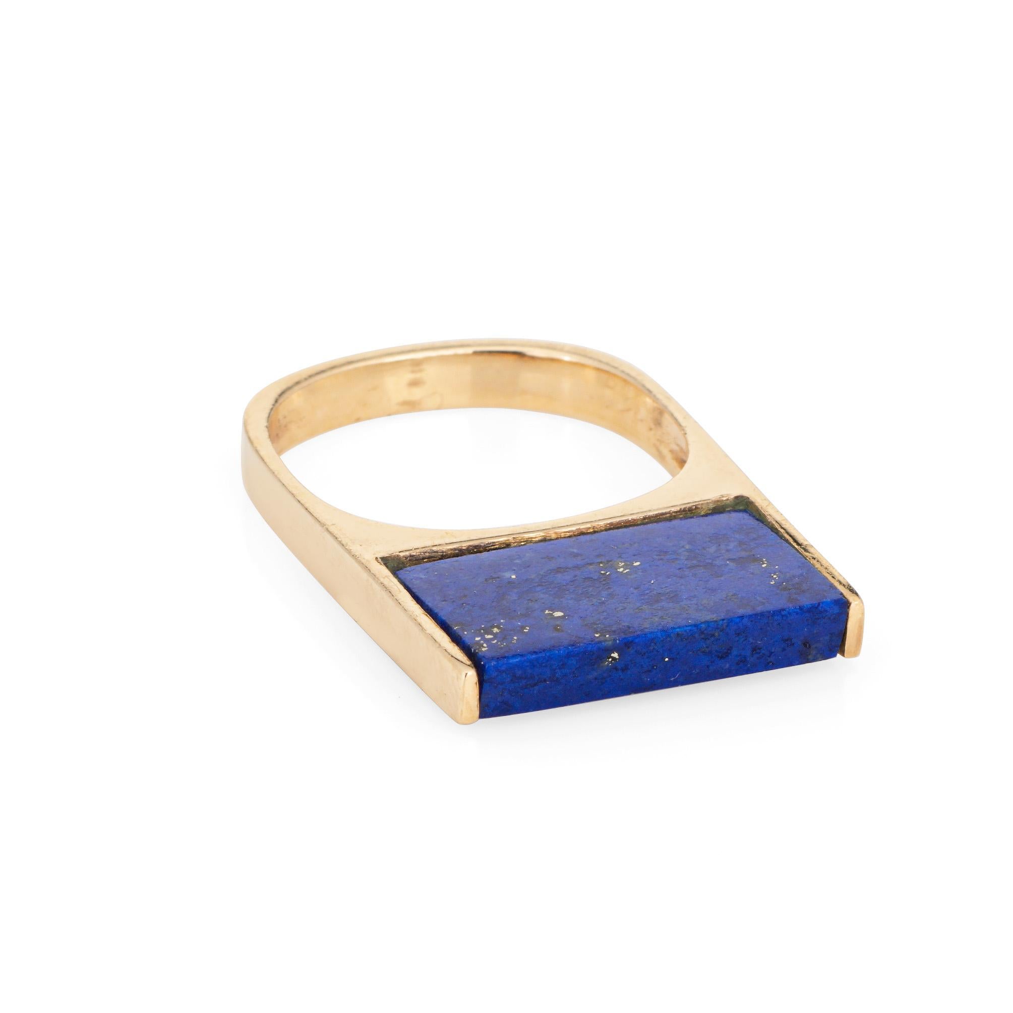 Stylish lapis lazuli square ring crafted in 14 karat yellow gold (circa 1970s). 

Lapis lazuli measures 15mm x 10mm. The lapis lazuli is in very good condition and free of cracks or chips.  

Popular in the 1970s and 1980s, the square ring is set