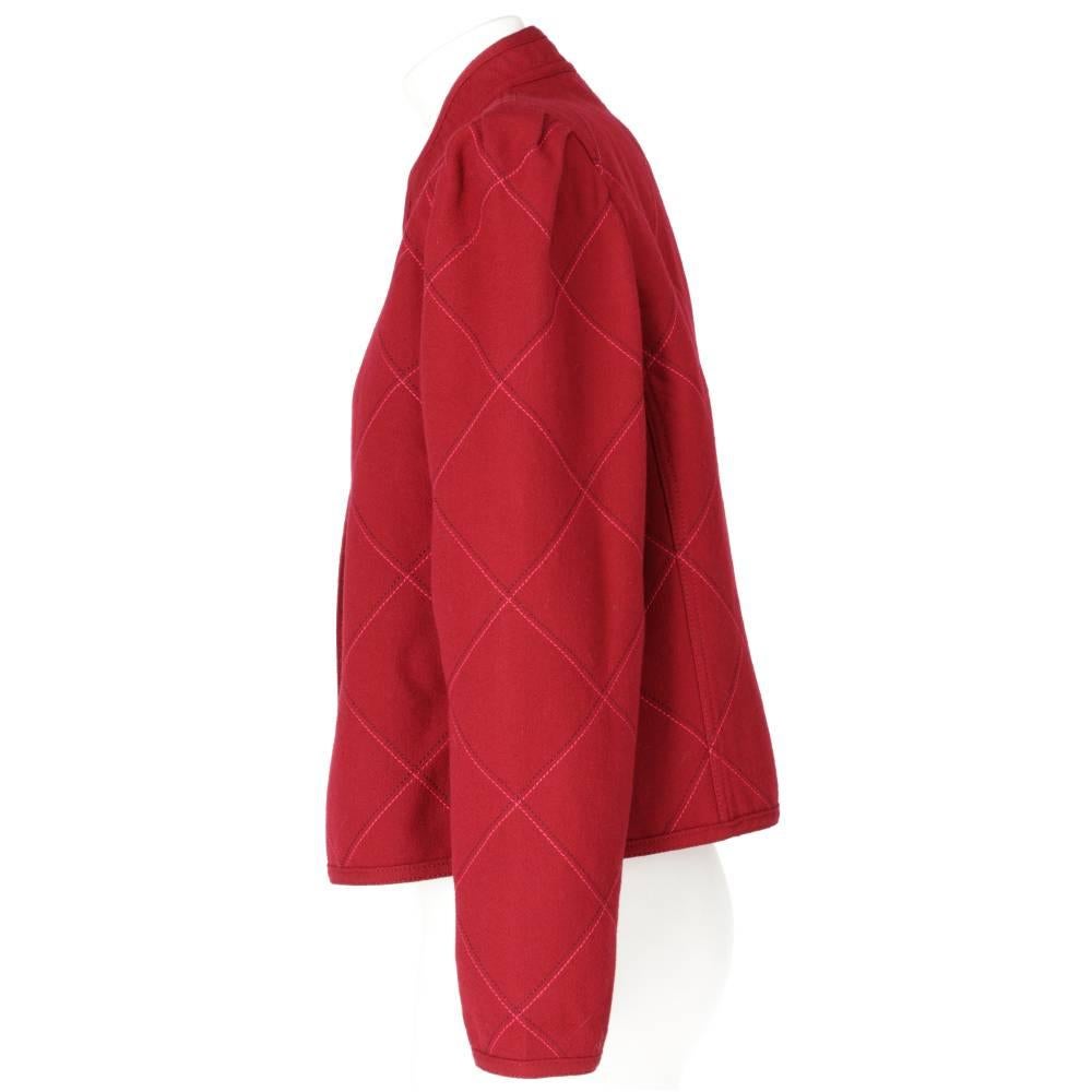 Louis Féraud amaranth red color wool open jacket with decorative geometric stitchings. Mandarin collar, long puff sleeves and unlined interior.

Years: 70s
Made in Germany

Size: 44 IT

Flat measurements
Height: 53 cm
Bust: 49 cm
Shoulders: 39
