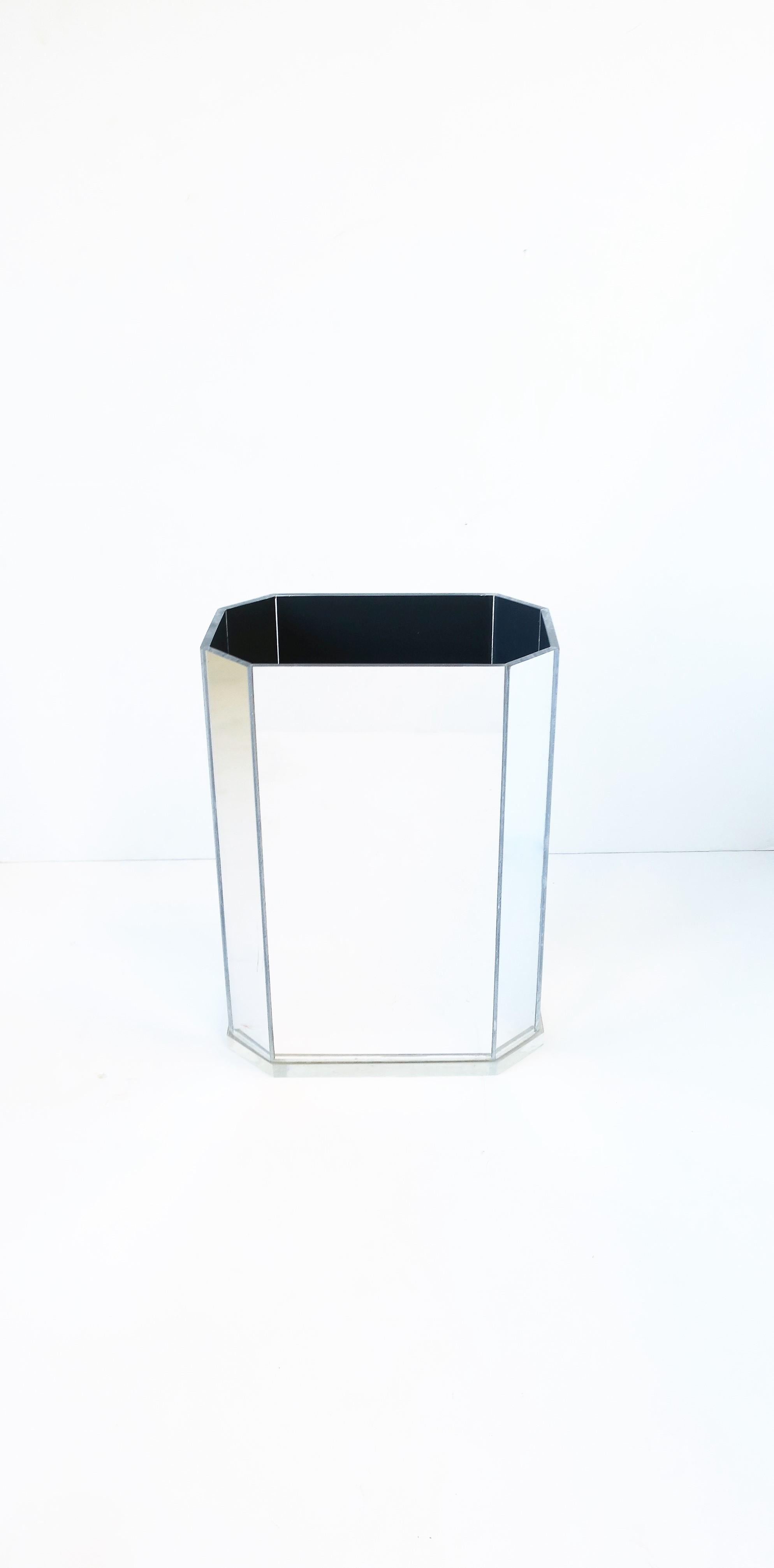A 1970s modern octagonal rectangle mirrored acrylic wastebasket (waste basket) or trash can, circa 1970s, late 20th century. A great addition is any office, home office, desk, walk-in closet, bathroom vanity area, etc. Dimensions: 6.25