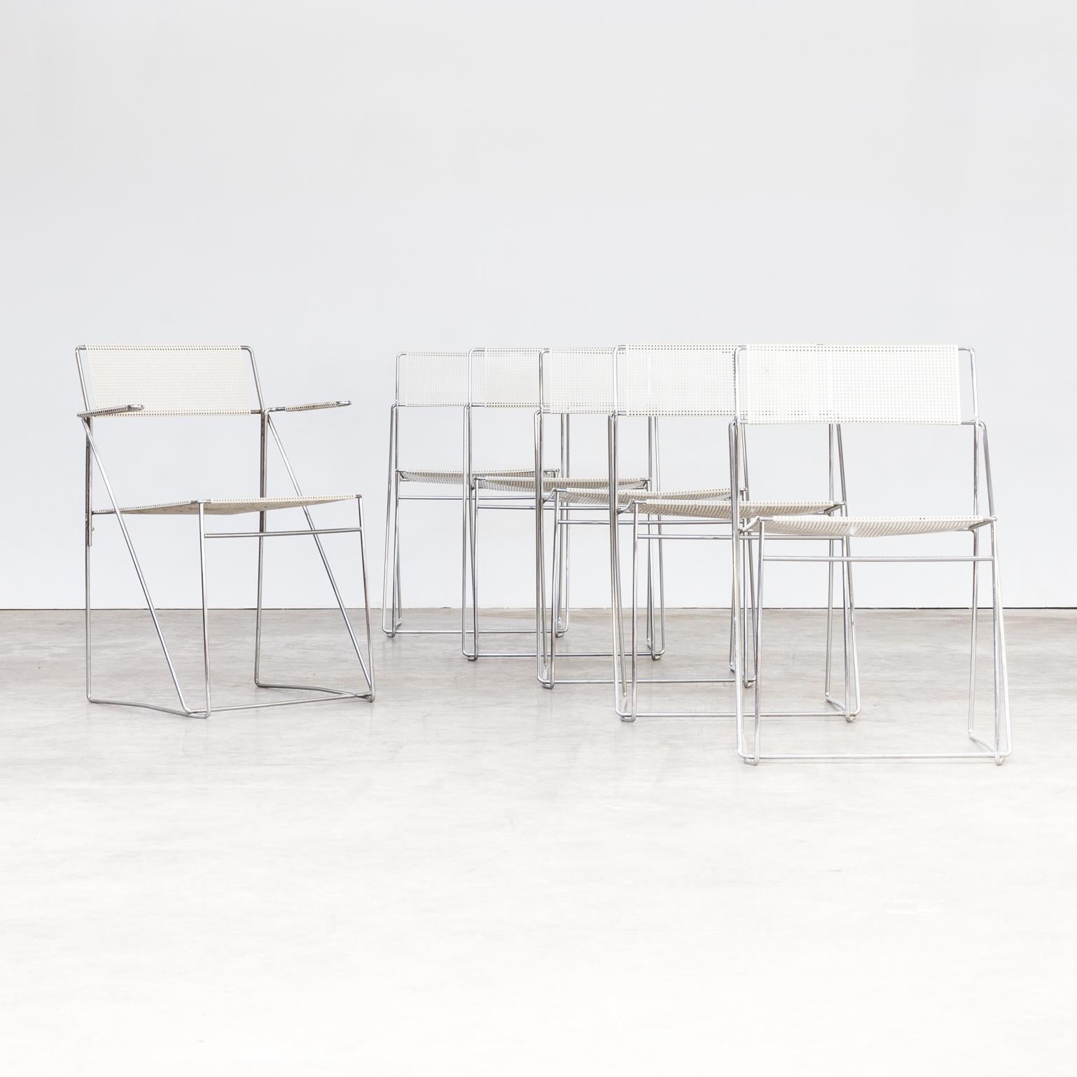1970s Niels Jorgen Haugesen ‘Nuova’ stackable chairs for Hybodan set of 6. One set of six Nuova chrome framed and metal lacquered chairs. 1 piece with armrests. Good condition consistent with age and use.