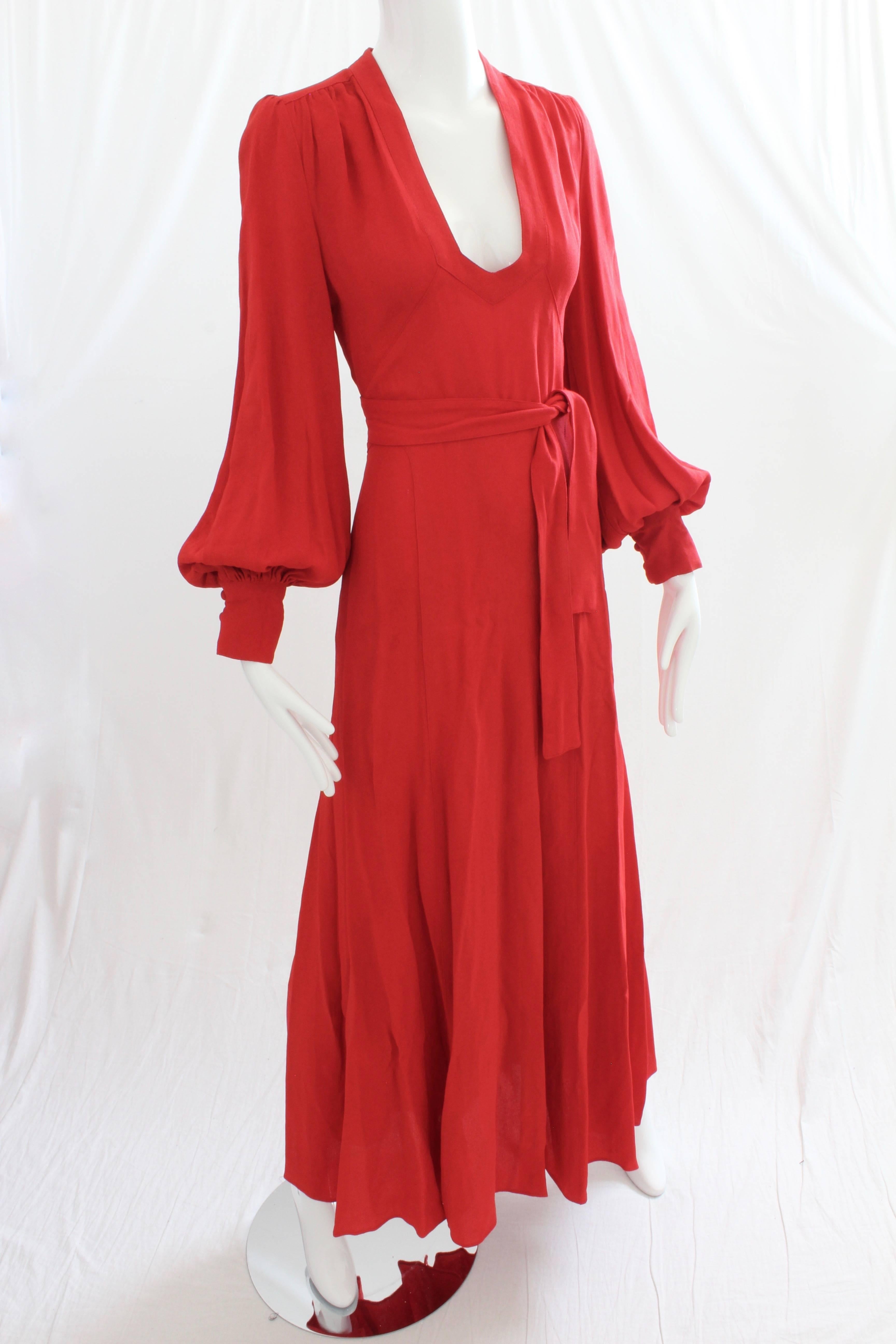 Here's a brilliant red 'Cuddle' dress from Ossie Clark for Radley. Made from Ossie's signature moss crepe fabric, this piece fastens wrap style, and features a plunging neckline, huge bishop sleeves and a sexy open back! So chic! Unlined and meant