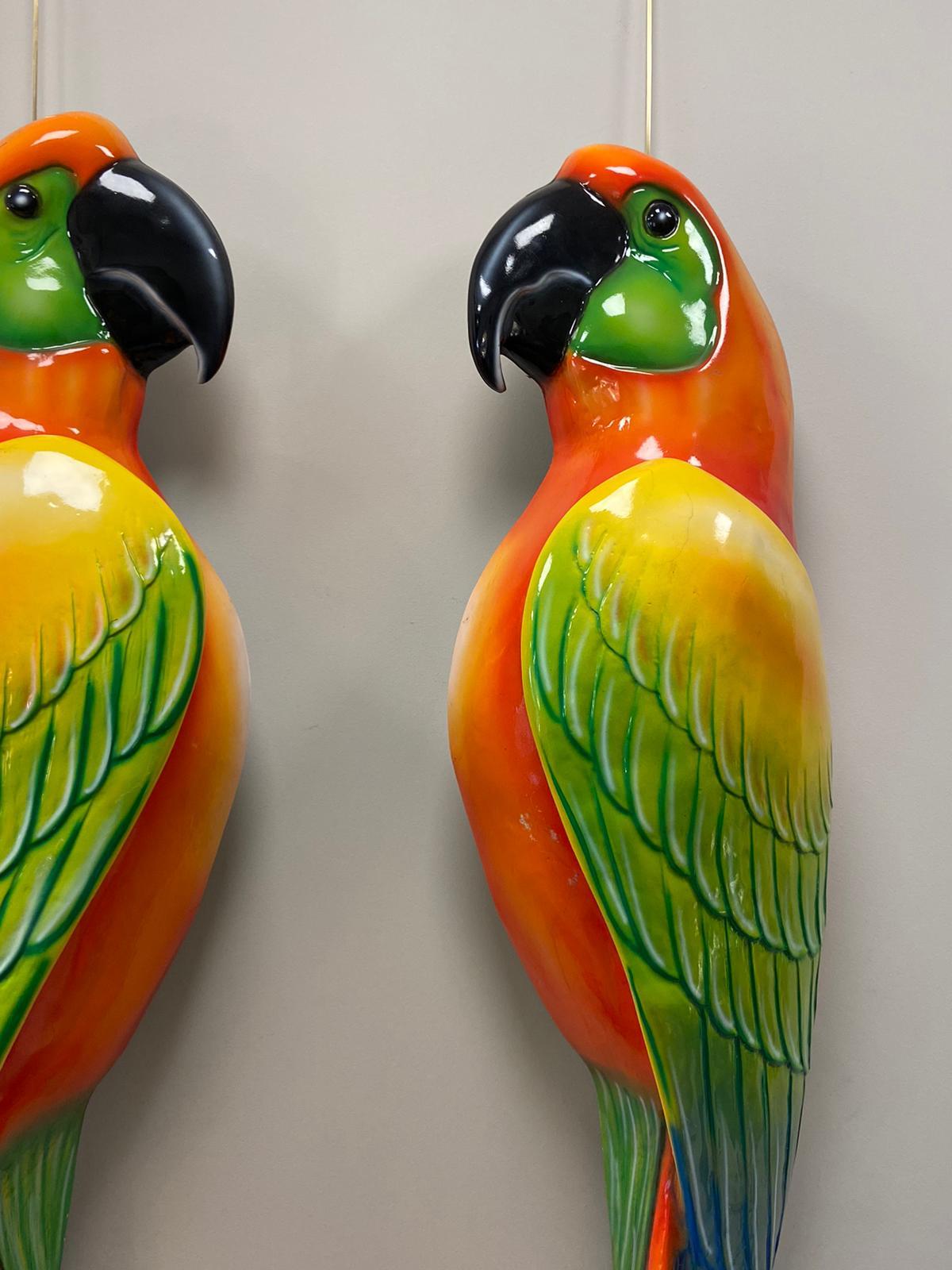 Stunning and amazing pair of fiberglass parrots, italian wall sculptures from the 70s
In very good condition for its use and time.
Of a extraordinary mix of colours as orange , green , blue , yellow and black made of epoxy. They are a couple as they