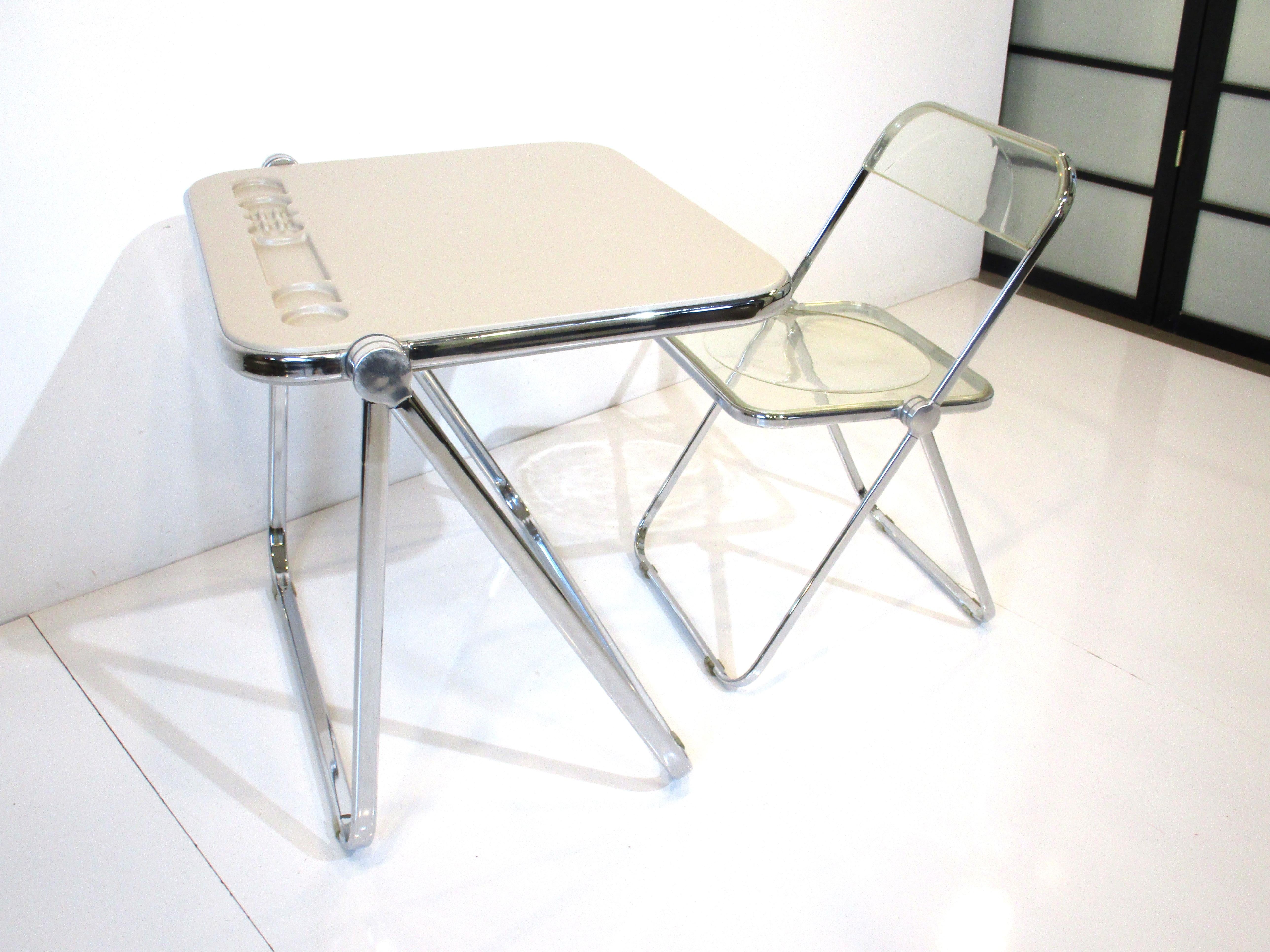 A very smartly designed Platone table and chair set that both fold flat for storage so when you need a desk or not it's perfect for a small space. Constructed in durable ABS plastic and chromed metal and aluminum with great detail designed by