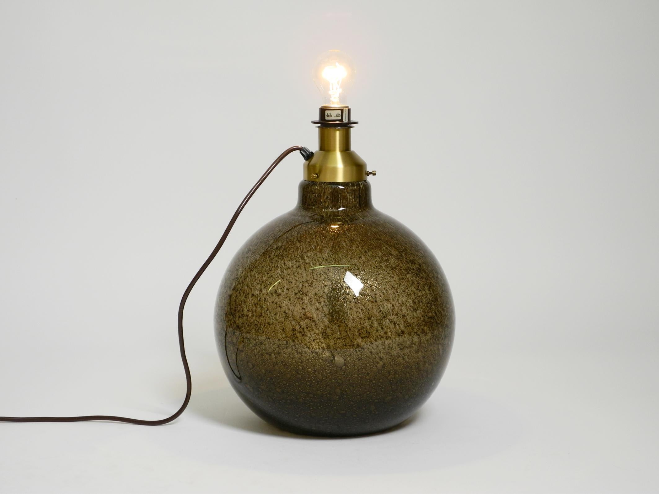 Metal 70s Putzler table lamp with illuminated glass body and shade made of dupion silk For Sale