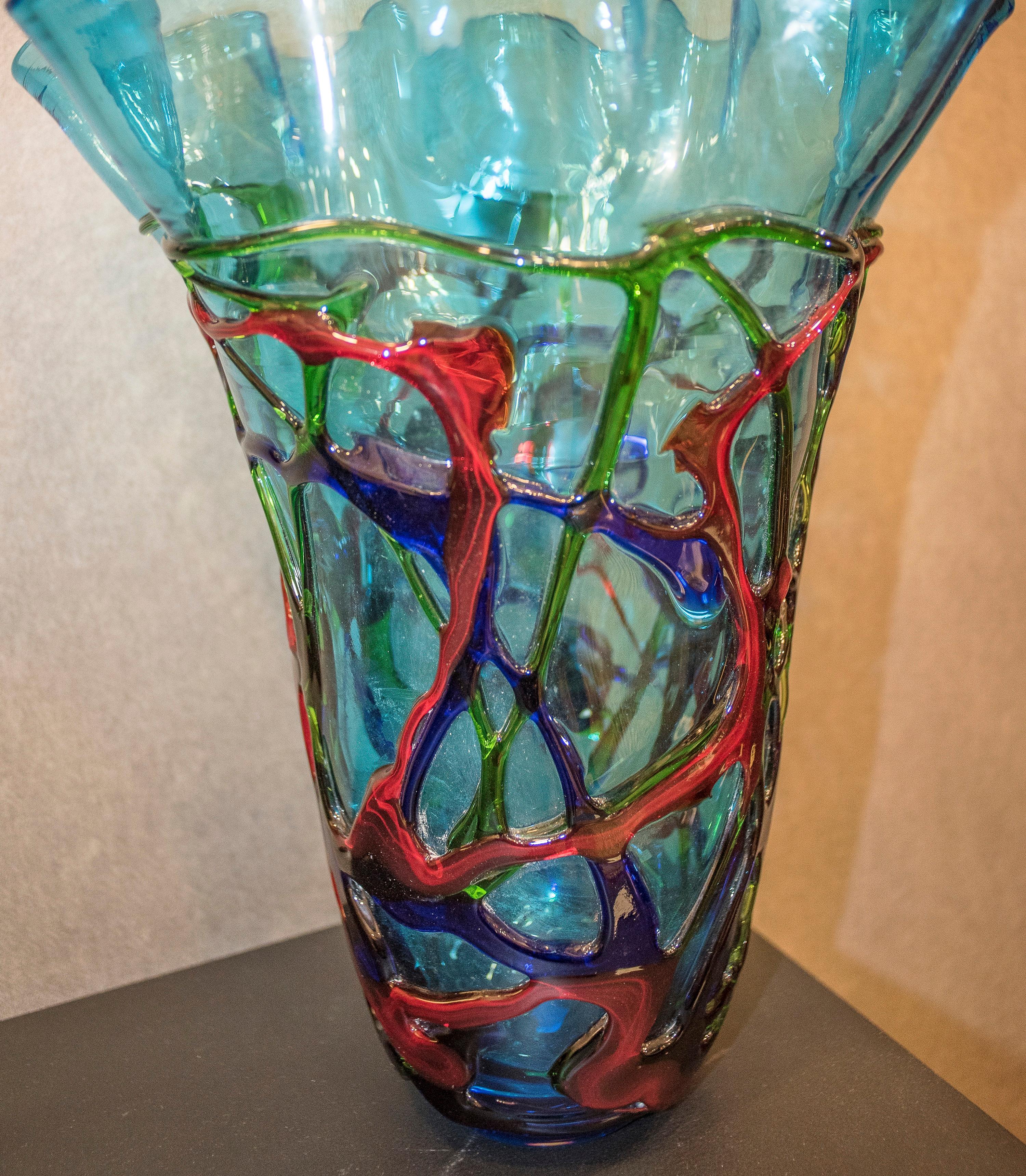 Stunning green, blue and red crystal vase by Murano Italy, midcentury 1970s.
It's in a perfect condition. It comes from a private North Italian collection. Is a unique piece.
Suitable in any corner or room giving a glamorous and sophisticated