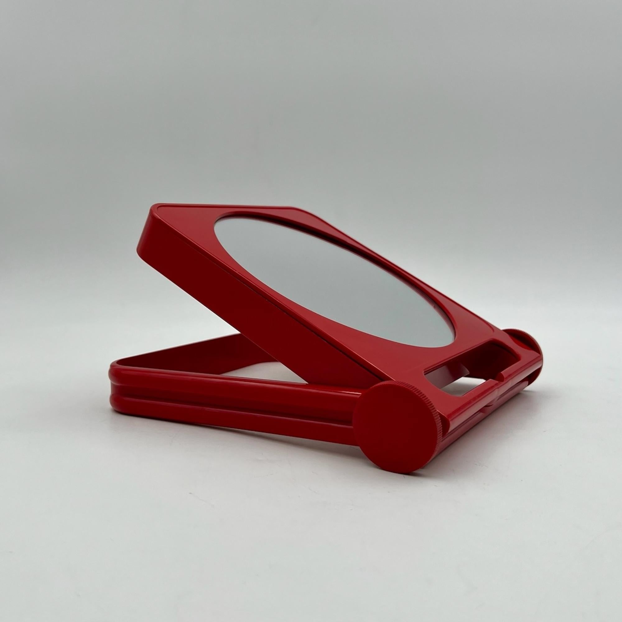 Step back into the glamorous 70s with this exquisite tabletop vanity mirror designed by Roberto Maderna for GEDY. Crafted in the 70s, this vintage piece is a perfect blend of functionality and iconic design.

Dual Mirror Design for Versatile