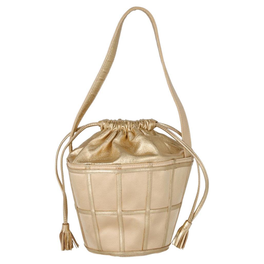 70s René Caovilla Vintage gold-tone leather bucket bag with silk satin details
