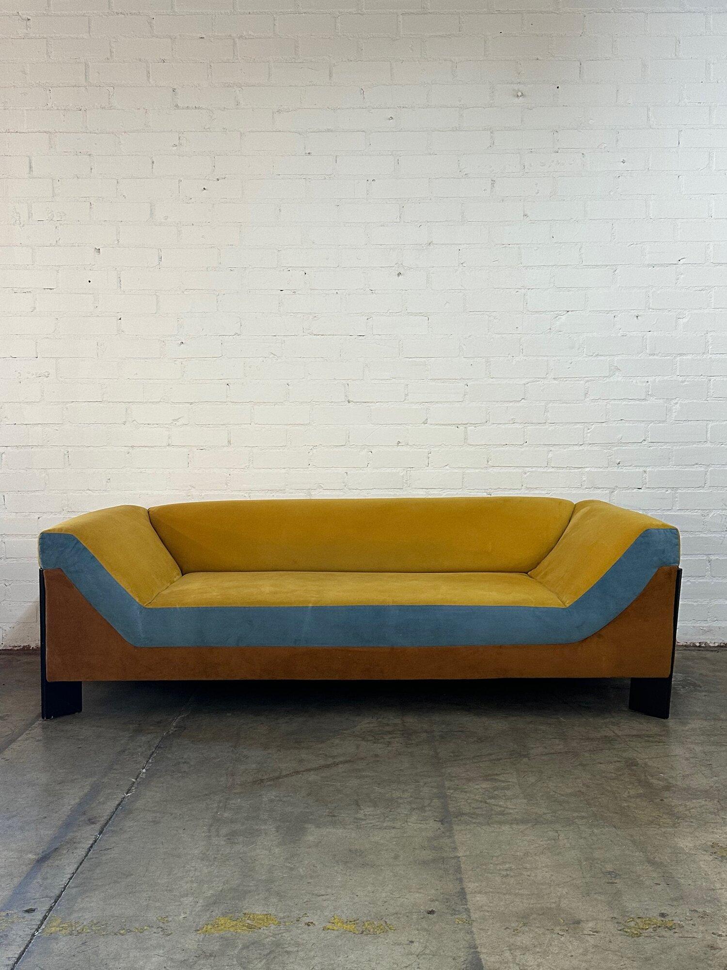 W90 D36.5 H28 SW59 SD27 SH13 AH13

This used Open Arms Sofa” is a custom piece made by Vintage On Point. Was made in house, here at our Los Angeles warehouse location. Upholstery is reminiscent of 70’s style vibrant colors in velvet. Since it’s used