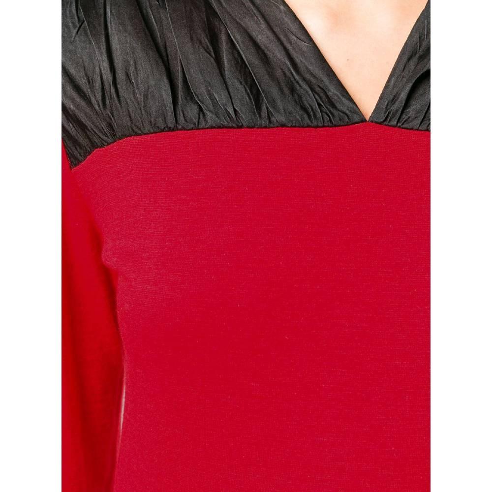 70s Ritz Saddler red wool midi dress with black silk insert. V-neck, padded shoulders, two lateral concealed pockets and side zip fastening.

Size: 42 IT

Flat measurements
Height: 97 cm
Bust: 38 cm
Sleeves: 55 cm
Shoulders: 34 cm

Product code: