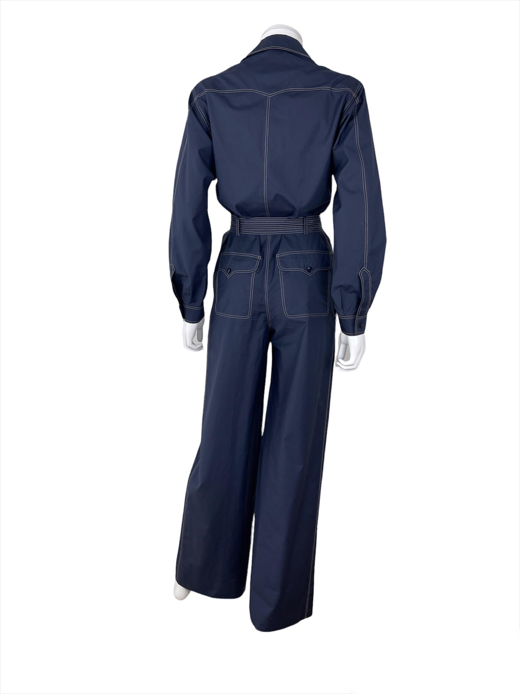 SAINT LAURENT Rive Gauche, Made in France, circa 70’s.

Beautiful Saint Laurent Rive Gauche belted jumpsuit in navy blue cotton.
Sides pockets. No lining. 

A wonderful piece of archive ! 
Size tag is 38 (vintage french) - I recommend it for a Small