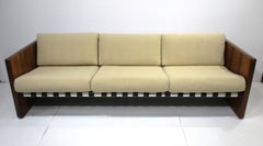 Divano Selig degli anni '70 in palissandro imbottito e con cinghie in pelle