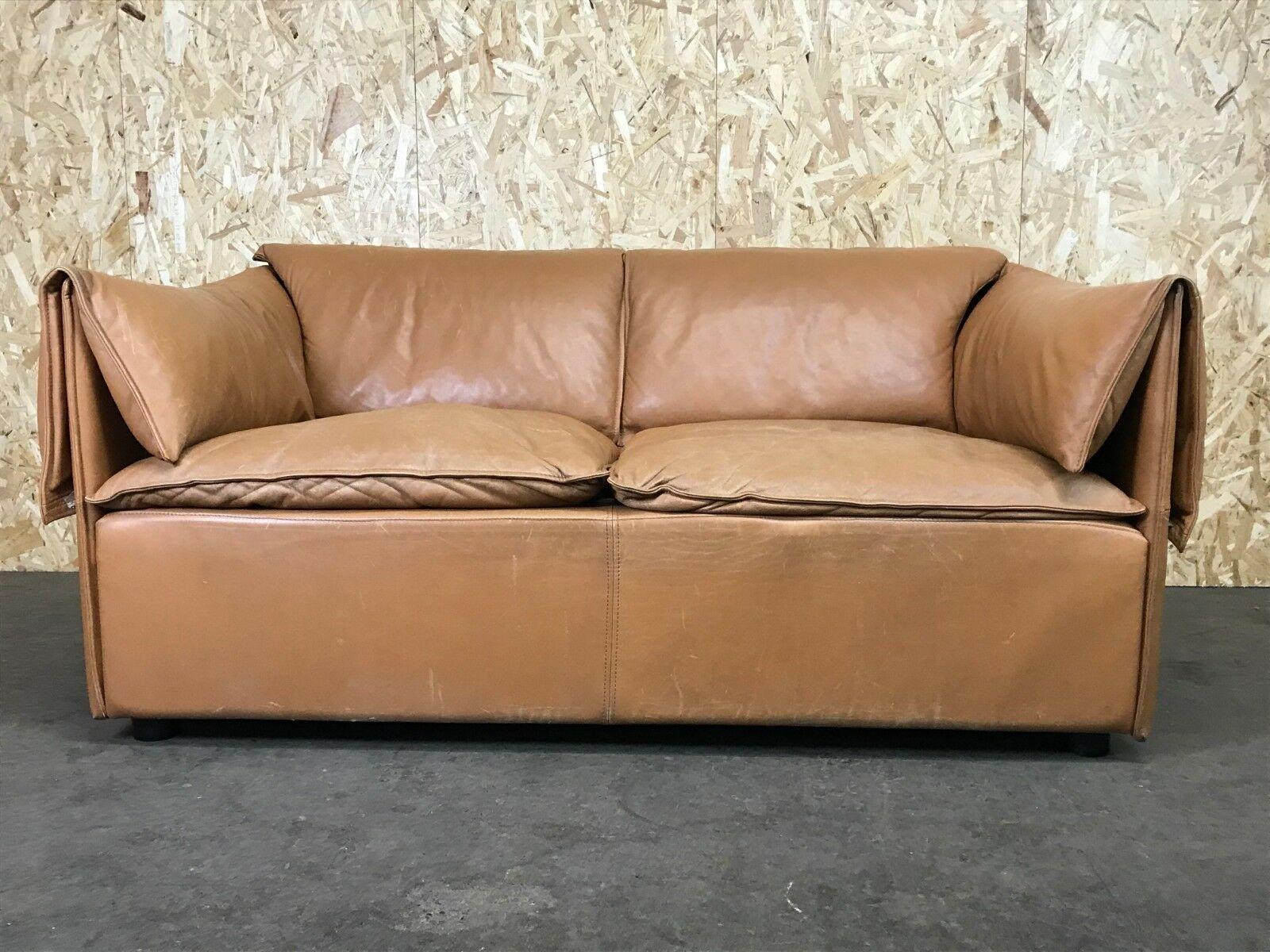 70s sofa 2 seater leather sofa Niels Bendtsen Lotus for N. Eilersen Danish Design

Object: sofa

Manufacturer: N. Eilersen

Condition: vintage

Age: around 1960-1970

Dimensions:

150cm x 90cm x 69cm
Seat height = 41cm

Other