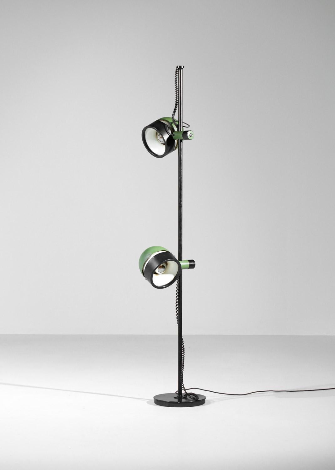 Vintage Spanish floor lamp from the 1970s. Black lacquered metal structure (original paint). Two adjustable lampshades in different positions, lacquered black, green and white. Original electrical system, provide dimmer bulbs. Very nice vintage