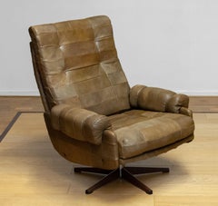 Chaise pivotante des années 70 par Arne Norell Möbel AB en cuir patchwork robuste vert olive