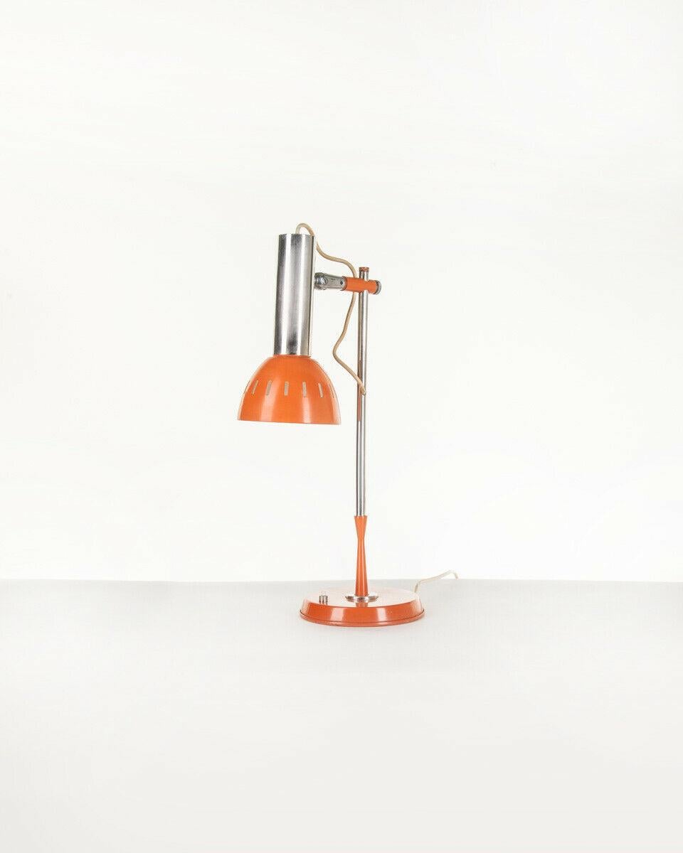 Table lamp in orange and chromed metal, adjustable lampshade, 1970s.

CONDITIONS: In good condition, working, it may show signs of wear due to time.

DIMENSIONS: Height 48 cm; Width 13 cm; Length 32 cm;

MATERIALS: Metal

YEAR OF PRODUCTION: