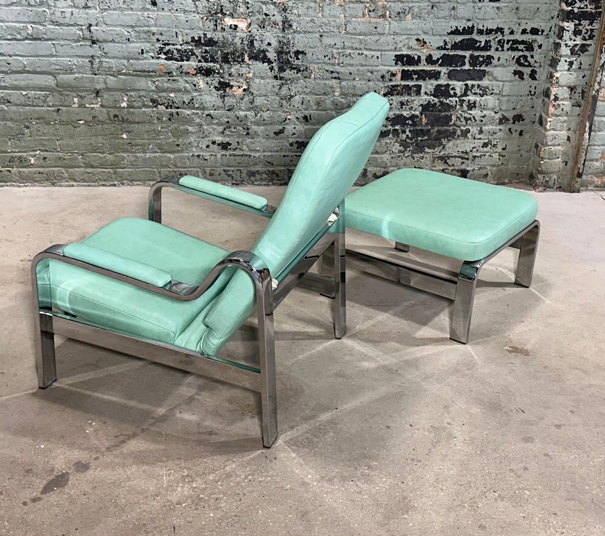 1970's Teal Leather and Chrome Lounge Chair and Ottoman. Chair reclines and has been newly reupholstered
Measures 34