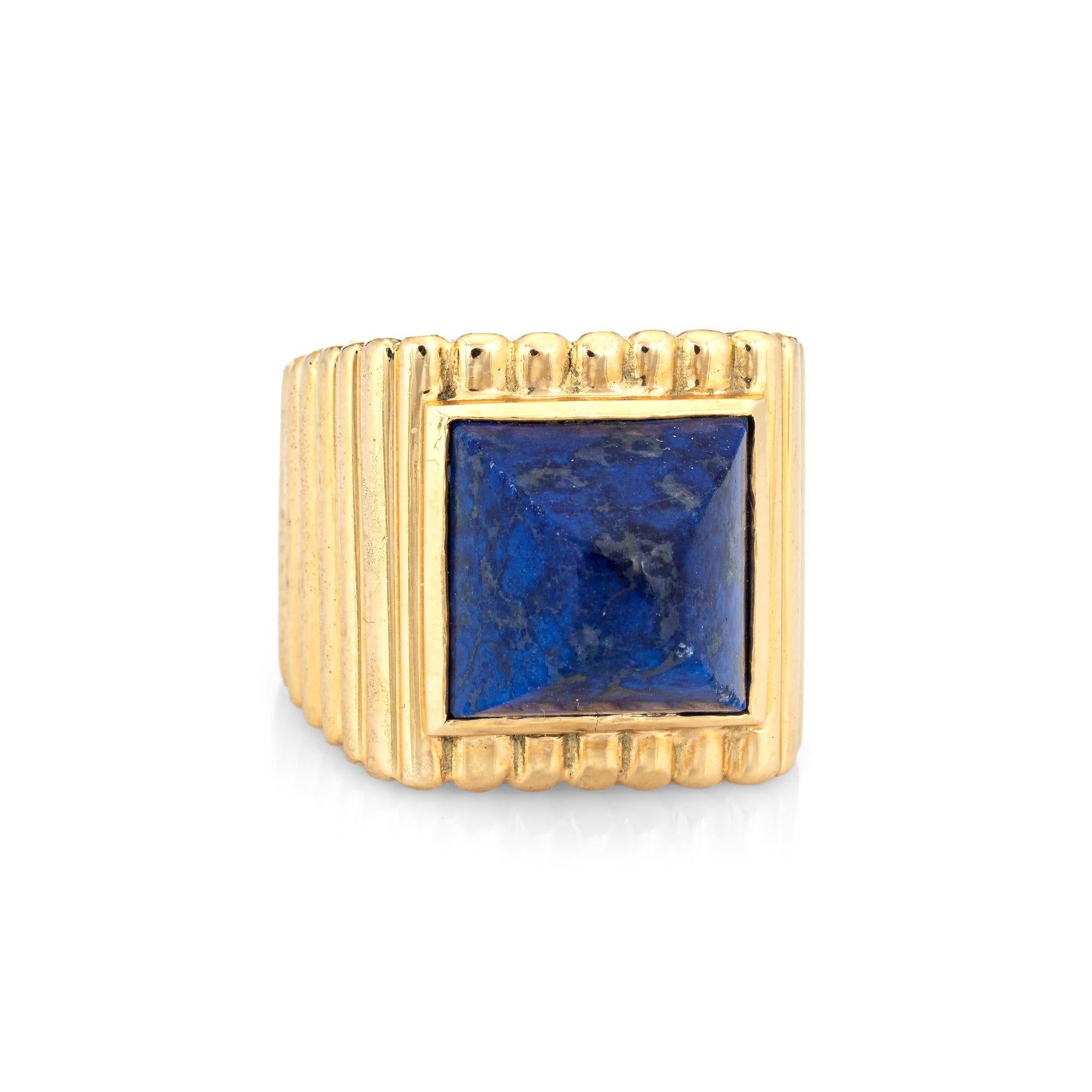 Vintage Tiffany & Co lapis lazuli ring crafted in 18 karat yellow gold (circa 1970s).  

Lapis lazuli measures 11mm diameter. The lapis is in good condition with some minor abrasions visible under a 10x loupe.

Dating to the 1970s the 18k gold ring
