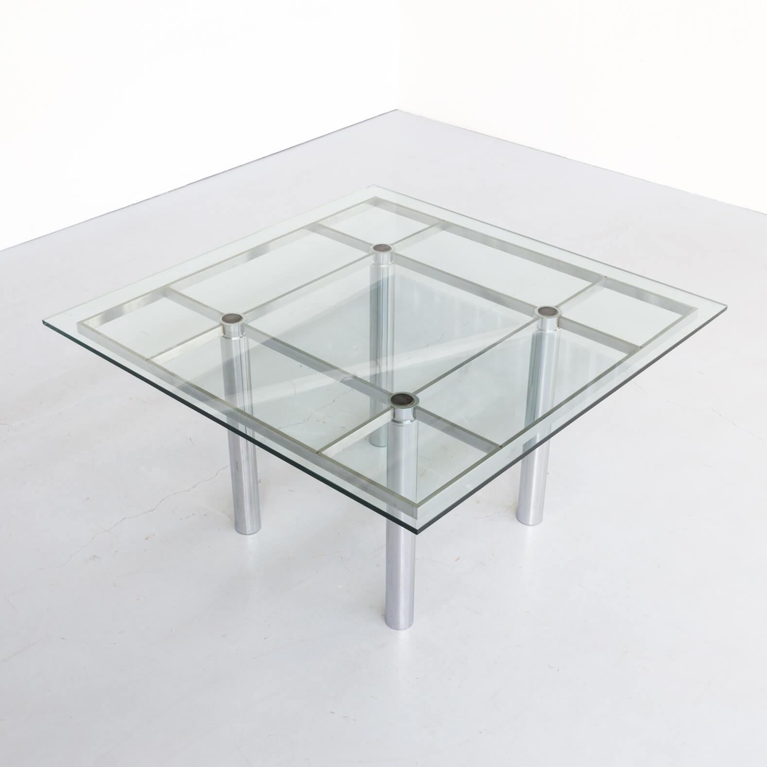 Beautiful square Andre glass and chromed steel design dining table for Gavina. Designed by the pair Tobia and Afra Scarpa in the 1970s. Good condition, small chip from the corner of the glass, consistent with age and use.