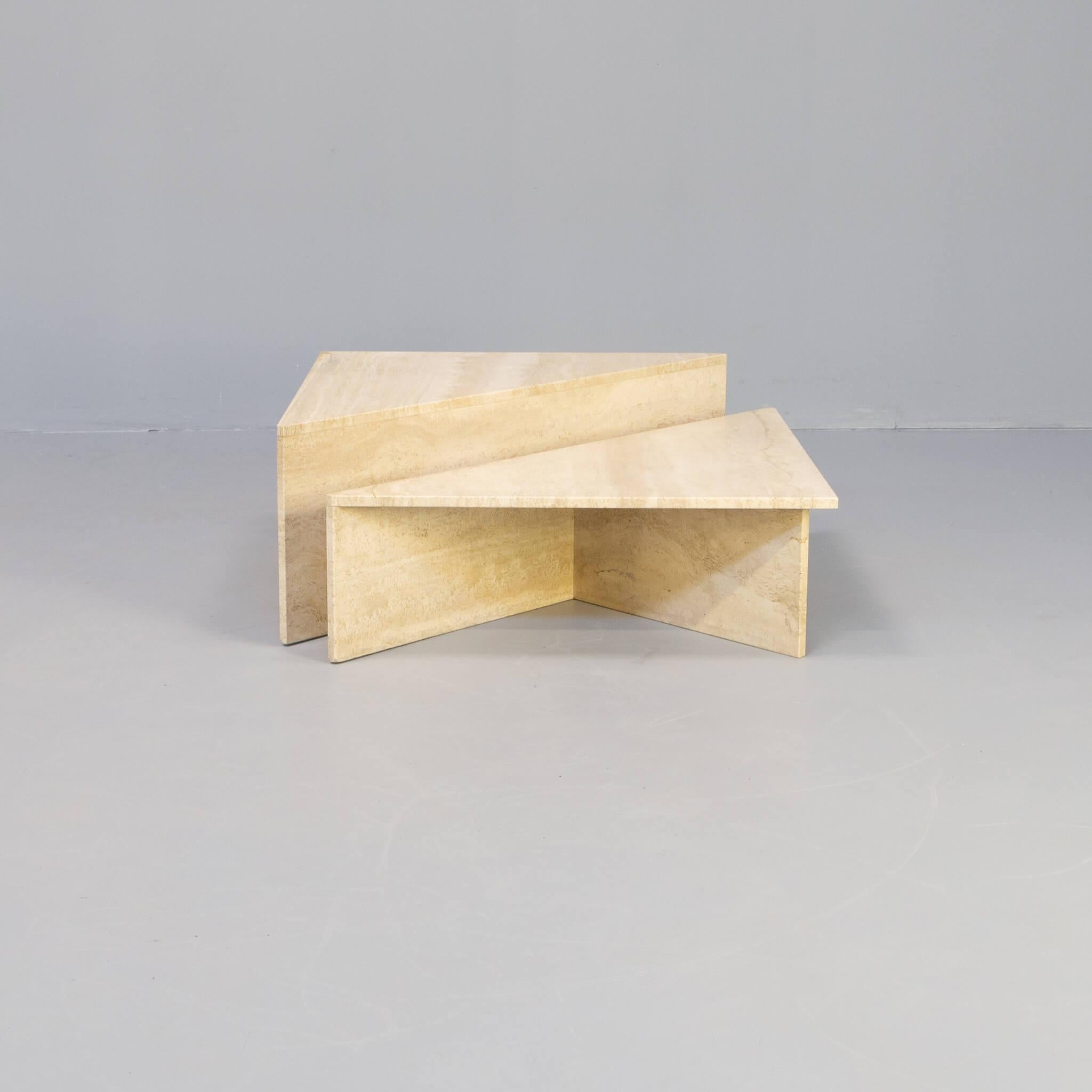 The two parts triangle coffee table is a good example of the early croftmenship in the company Up & Up. Triangle lines, and sawing under degree give these travertine coffee table the detailed looks a quality product needs. This set is from the early