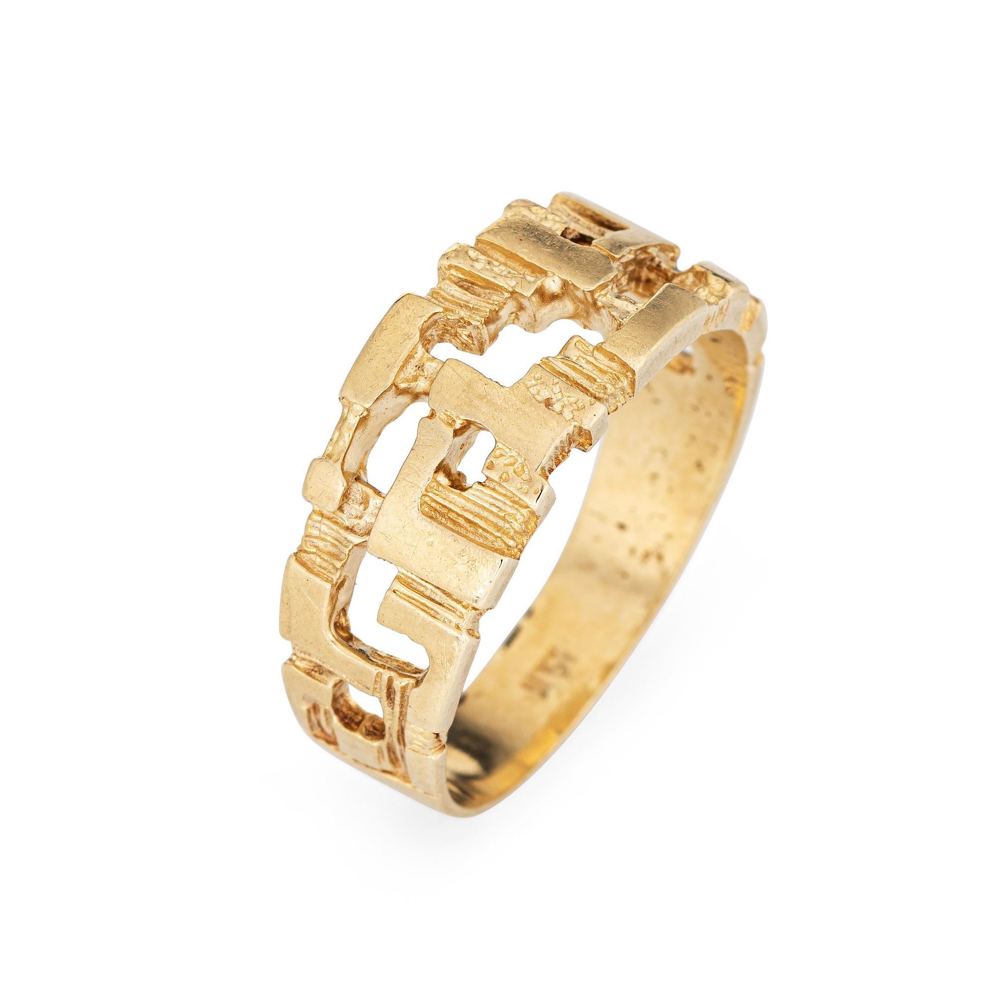 Stylish vintage abstract ring (circa 1970s) crafted in 14 karat yellow gold. 

The distinct ring features a fun abstract design, great for wear alone or stacked with your fine jewelry from any era. The low rise ring (2.5mm - 0.09 inches) sits