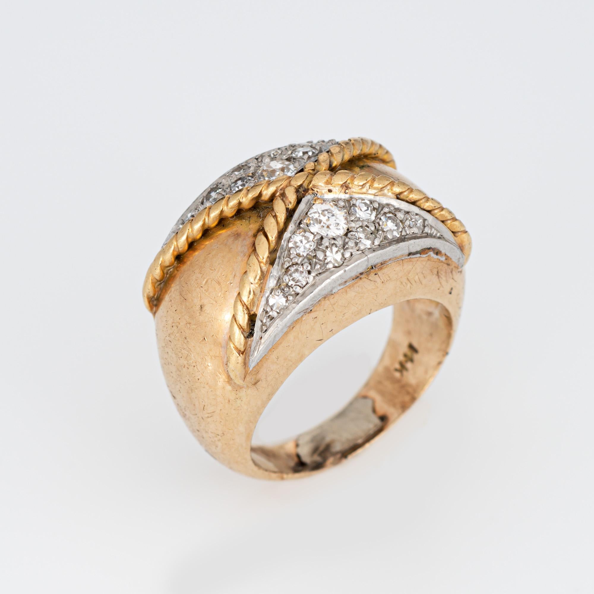 Stylish vintage diamond low dome ring (circa 1970s) crafted in 14 karat yellow gold. 

Old European and single cut diamonds total an estimated 0.20 carats (estimated at I-J color and SI2-I2 clarity). 

The low dome band with a distinct crossover