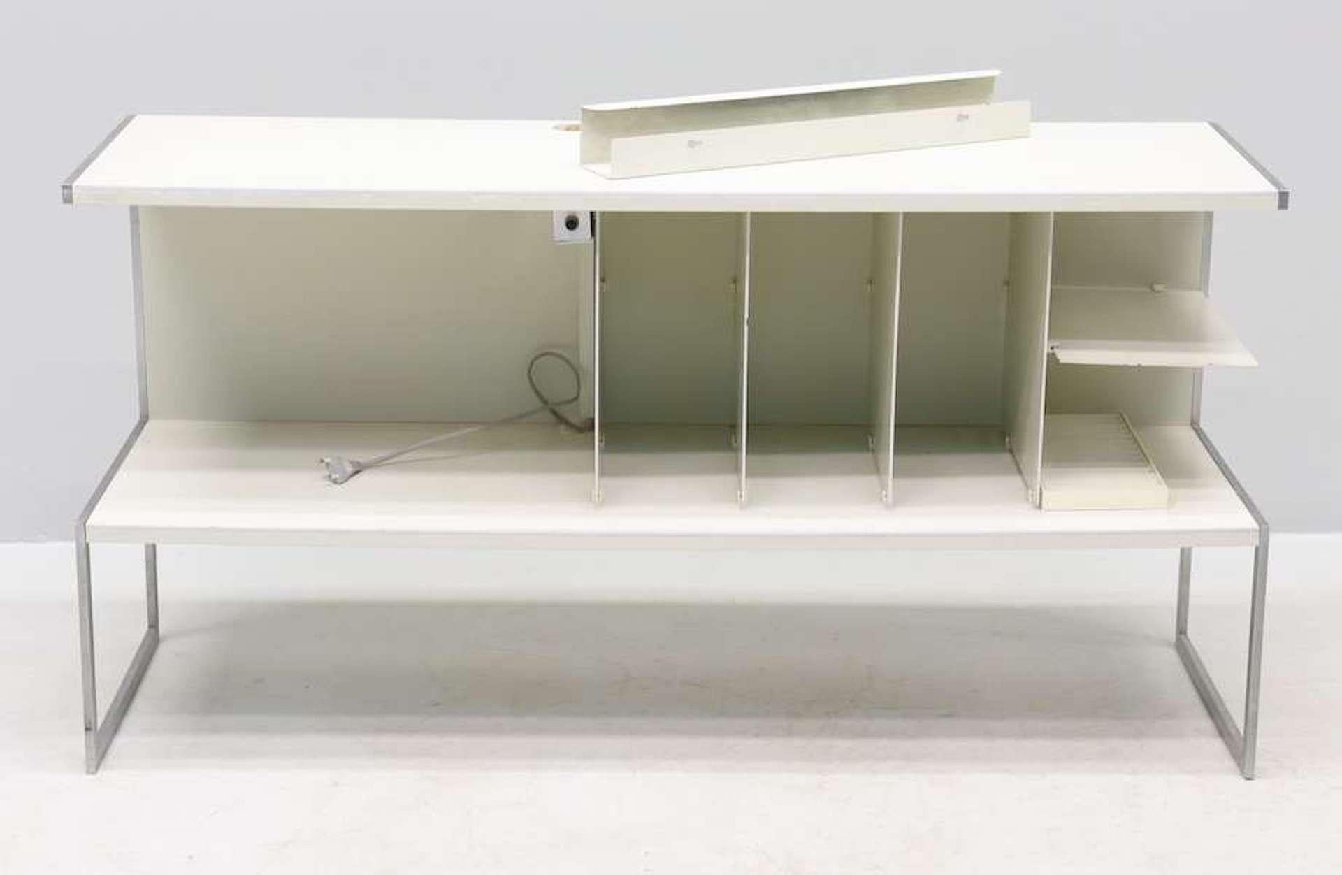 Absolutely rare system cabinet / audio cabinet in white combined with stainless steel stands and details designed by Jacob Jensen for Bang & Olufsen in Denmark Type: 2064 Model: SC50. 
It's a great system cabinet / audio cabinet to display your