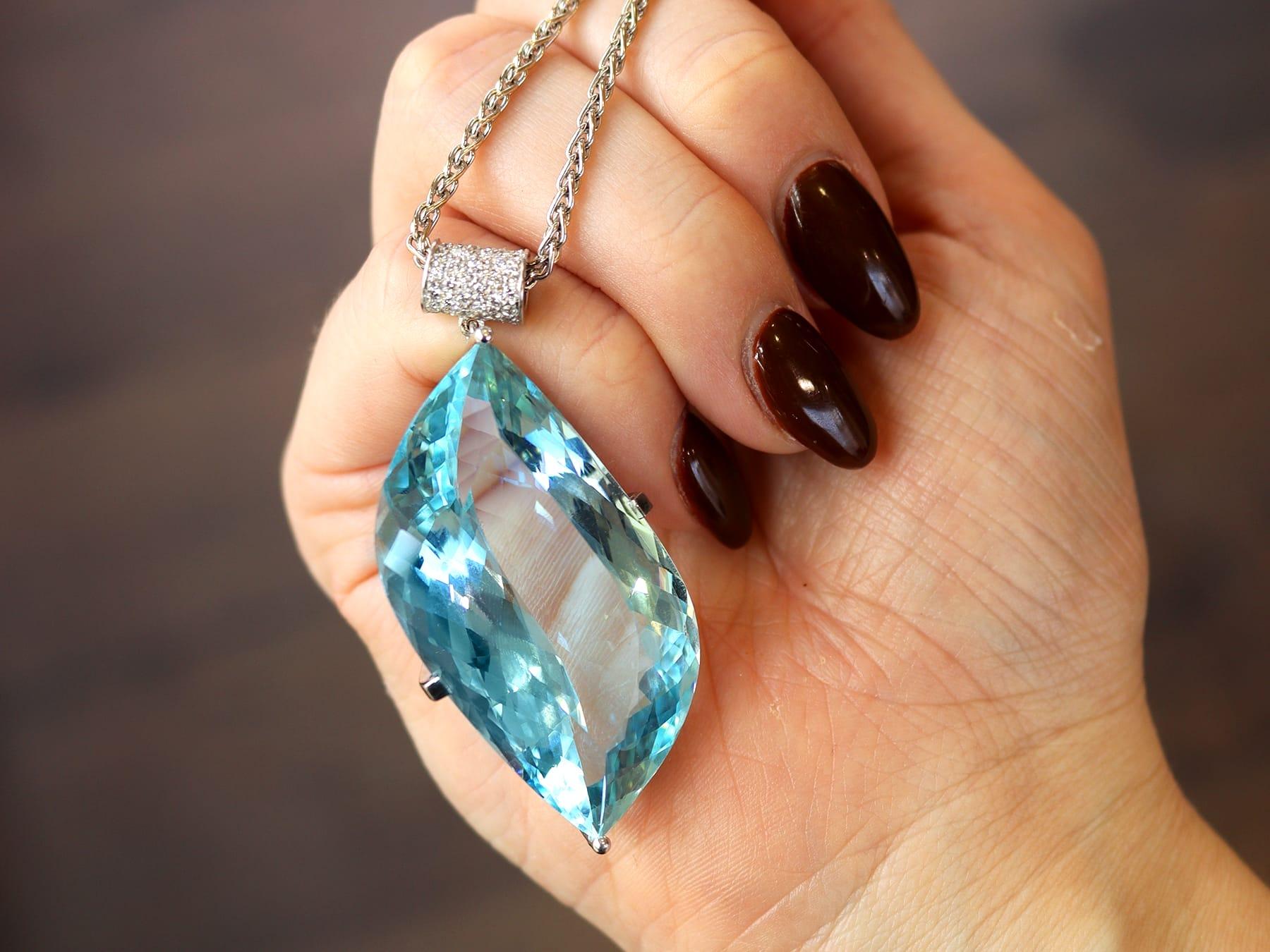 Round Cut 71 Carat Aquamarine, 0.38 Carat Diamond and 18k White Gold Pendant Circa 1970 For Sale