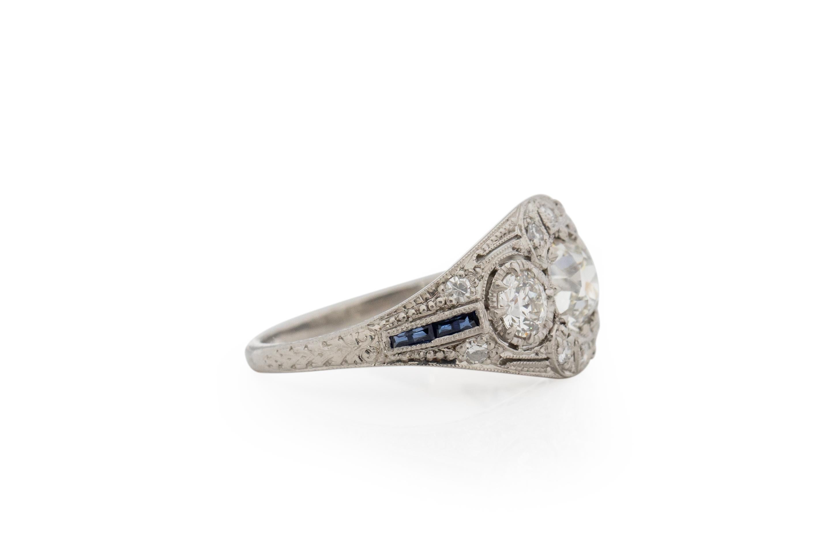 Ring Size: 6
Metal Type: Platinum [Hallmarked, and Tested]
Weight: .0 grams

Center Diamond Details:
Weight: .71 carat
Cut: Old European Brilliant
Color: I-J
Clarity: VS

Side Stone Details:
Weight: .65 carat total weight
Cut: Old European