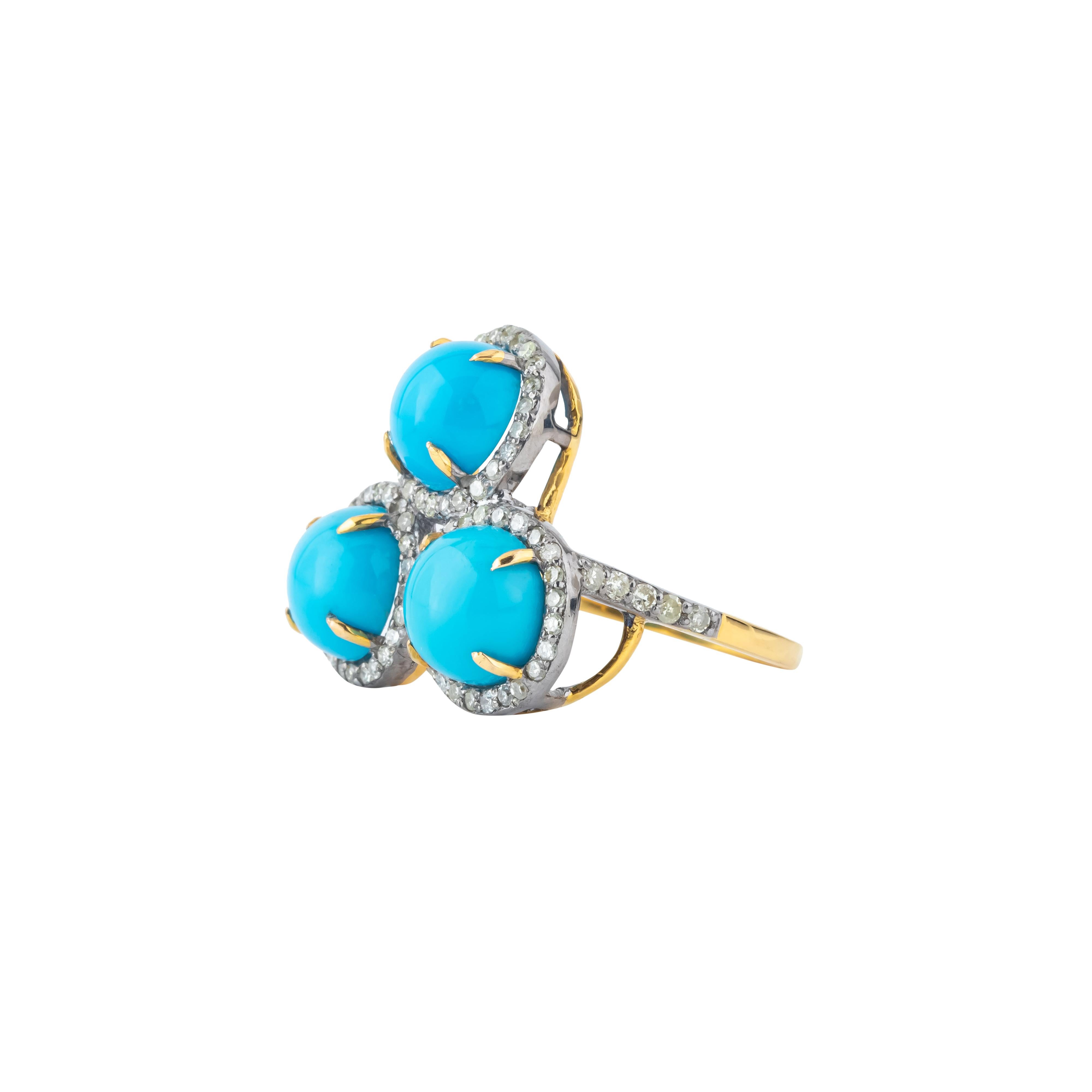 This 7.1 Carat Diamond and Turquoise Three Stone Ring exemplifies a harmonious fusion of classic glamour and vibrant artistry. At its heart, the ring features a striking arrangement of three distinct stones: a central diamond of remarkable