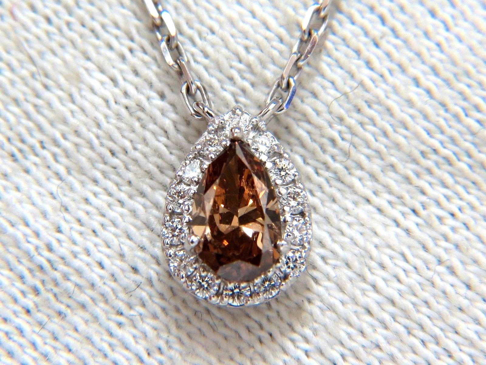 .46ct. Natural pear shaped fancy brown diamond necklace. 

Pear Brilliant cut

Vs-2  clarity

6.4 x 4.5mm

Additional 4 diamonds on chain & side diamond of halo:

.25ct. G-color Vs-2 clarity.

Pendant: 

9.6 x 6.8mm 

Necklace

16 inches in