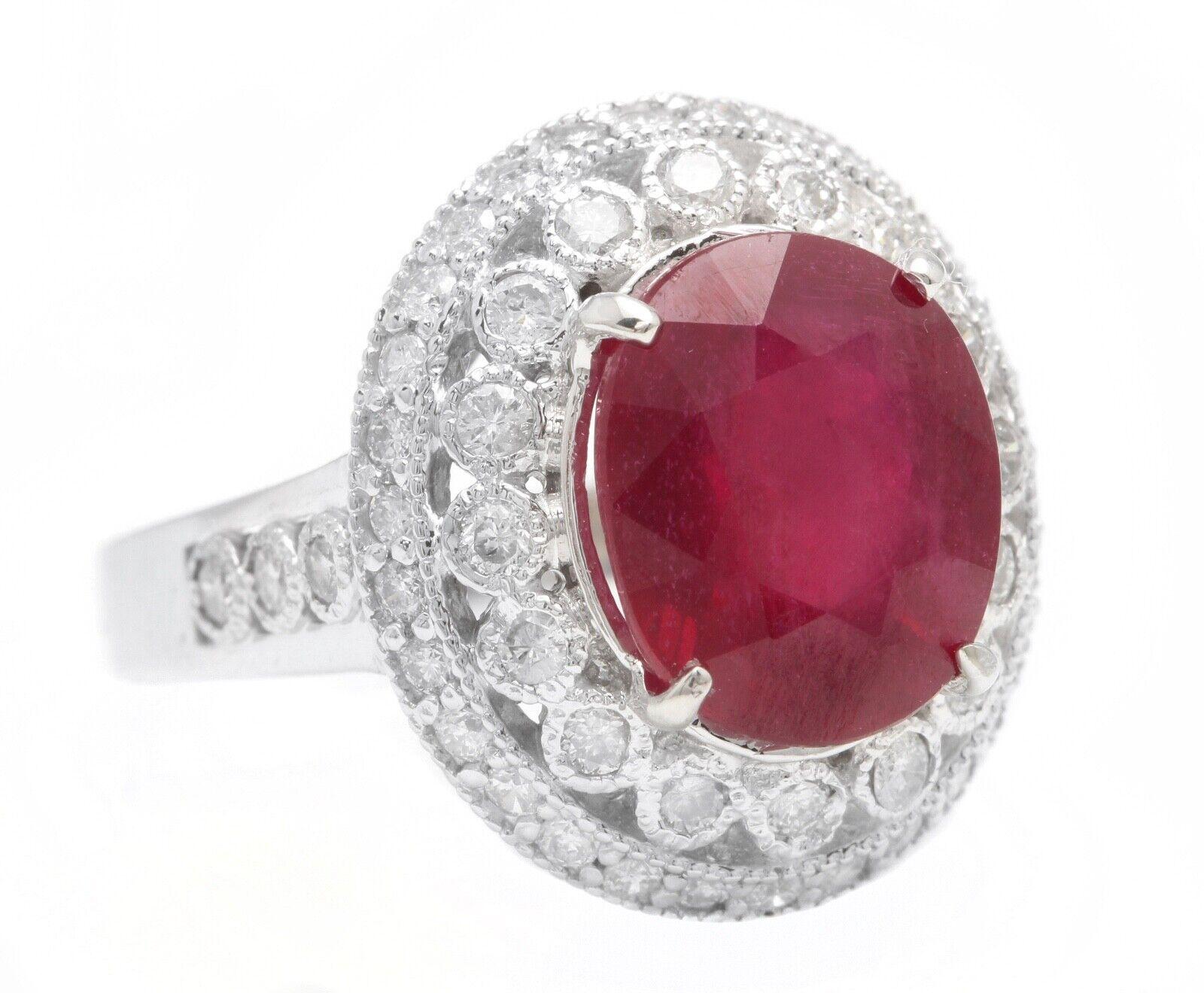 7.10 Carats Impressive Natural Red Ruby and Diamond 14K White Gold Ring

Suggested Replacement Value: $6,000.00

Total Red Ruby Weight is: Approx. 6.00 Carats (Lead Glass Filled)

Ruby Measures: Approx. 11.80 x 9.80 mm

Natural Round Diamonds