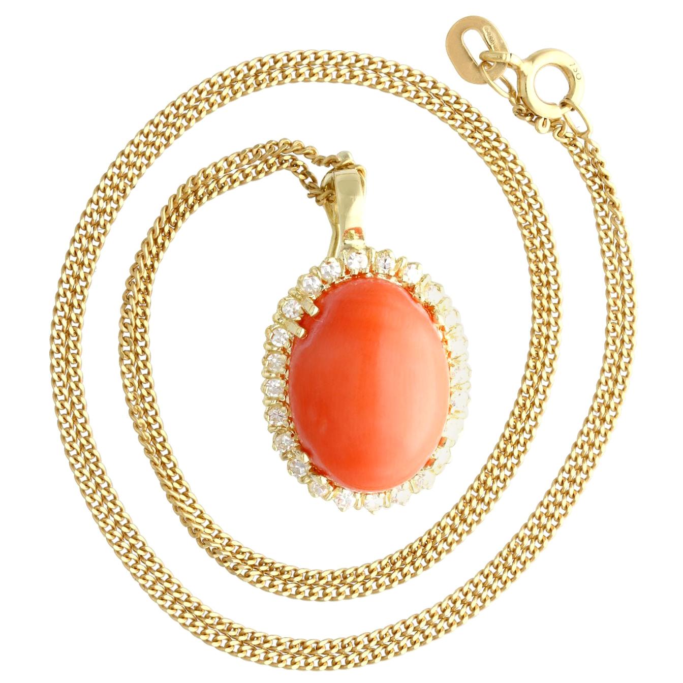 A fine and impressive vintage 7.10 carat coral and 0.48 carat diamond, 14 karat yellow gold pendant; part of our diverse vintage estate jewelry collections.

This fine and impressive vintage pendant has been crafted in 14k yellow gold.

The pierced