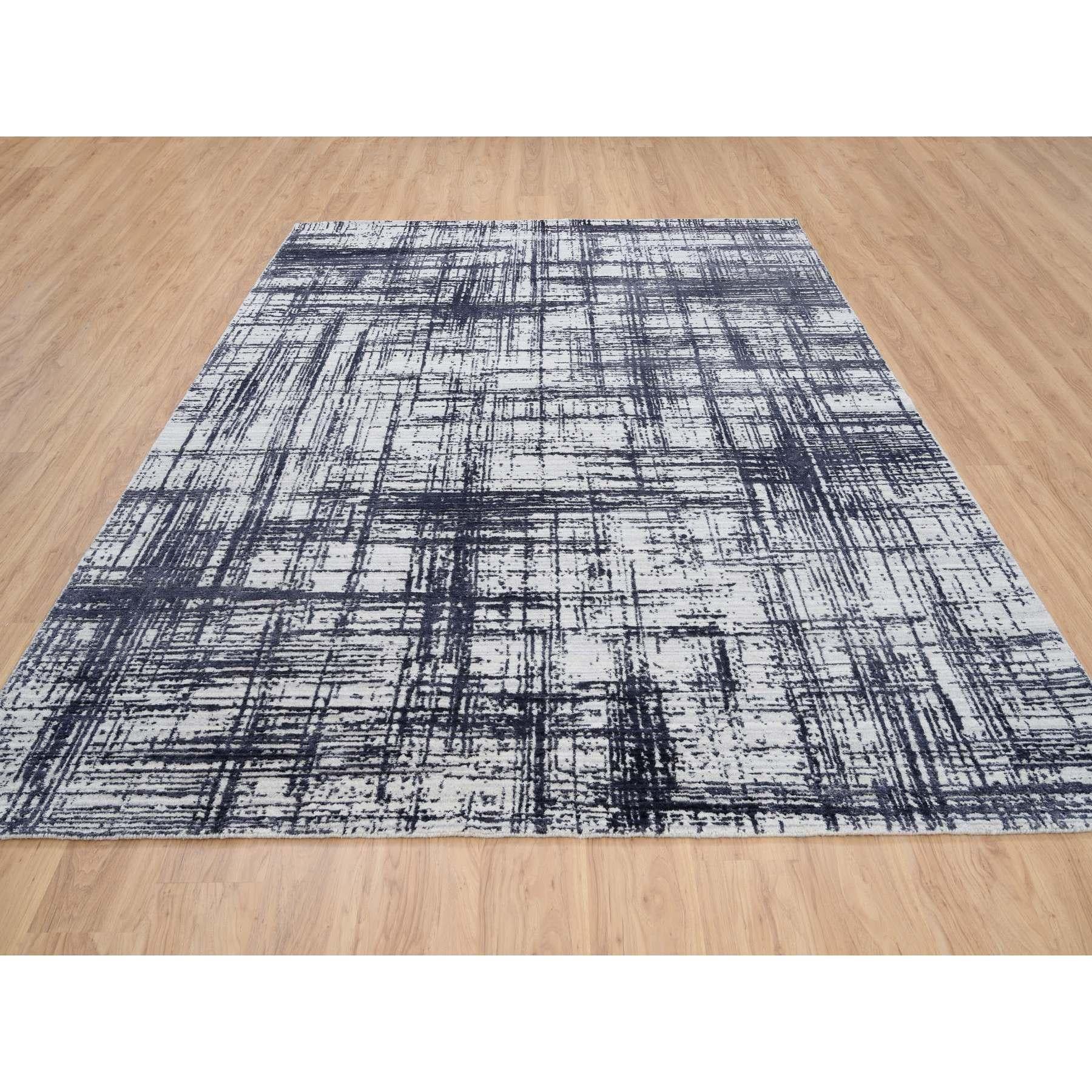 This is a truly genuine one-of-a-kind Charcoal Black, Hand Loomed, Modern Erased Lines Design, Wool and Plant Based Silk, Oriental Rug. It has been Loomed for months and months in the centuries-old weaving craftsmanship techniques by expert
