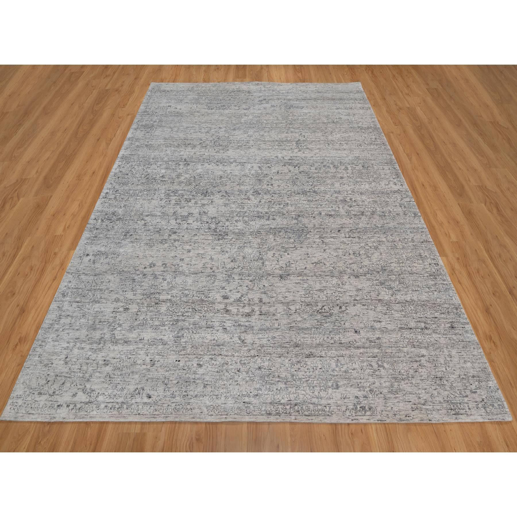 Bianco porcellana con colori tenui, trama nepalese, design moderno, lana naturale non colorata, rasato basso, tono su tono, annodato a mano, Tappeto orientale
Materiali primari: Lana
Lattice: No Pile 
altezza: 0,25 pollici
Stile: