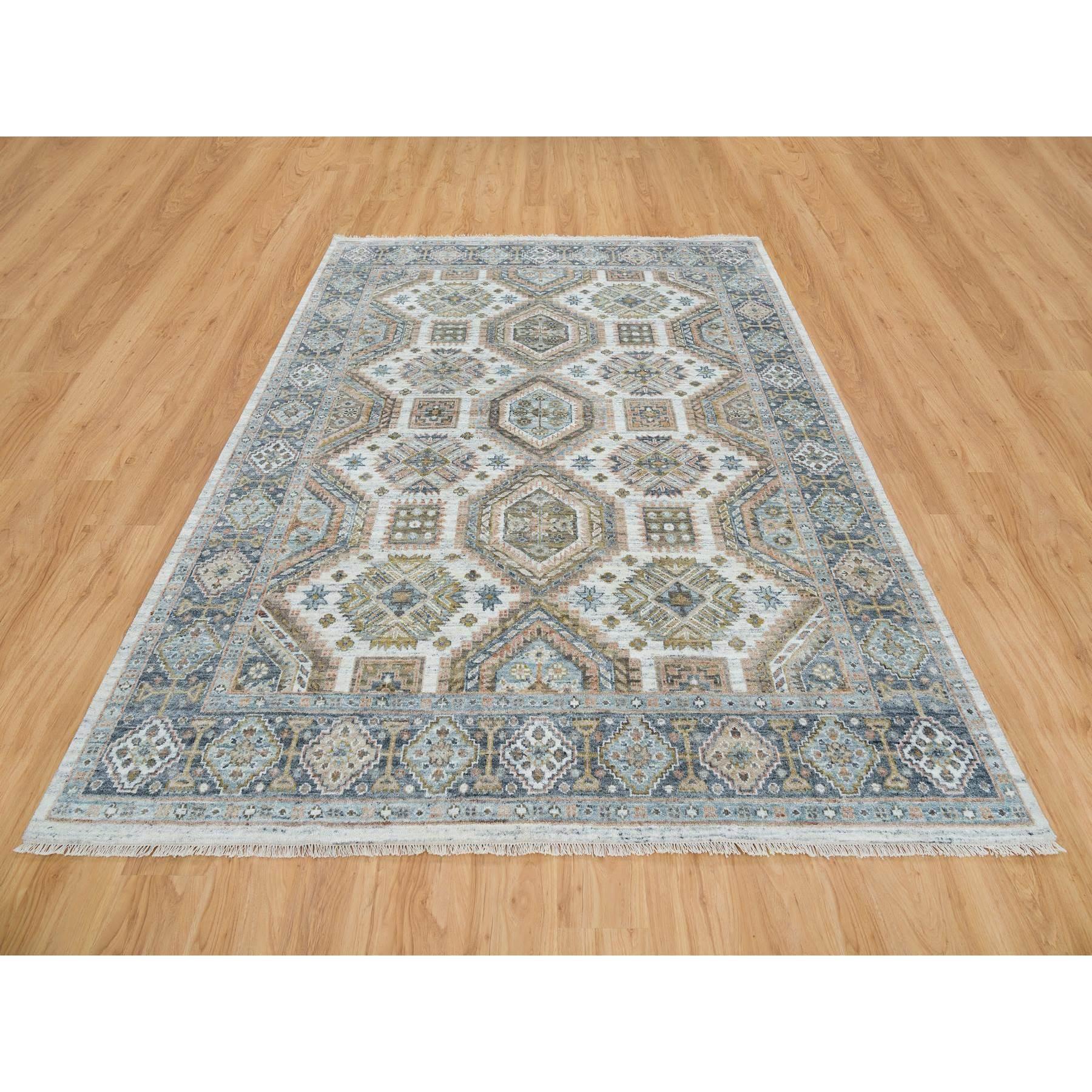Ivory, Plush and Lush Pile Pure Wool, Hand Knotted Karajeh Heritage Design, Oriental Rug
Primary materials: Wool
Latex: No Pile 
height: 0.25 Inches
Style: Traditional
Primary color: Ivory
Secondary colors: Yellow, Light Blue, Gray, Green,