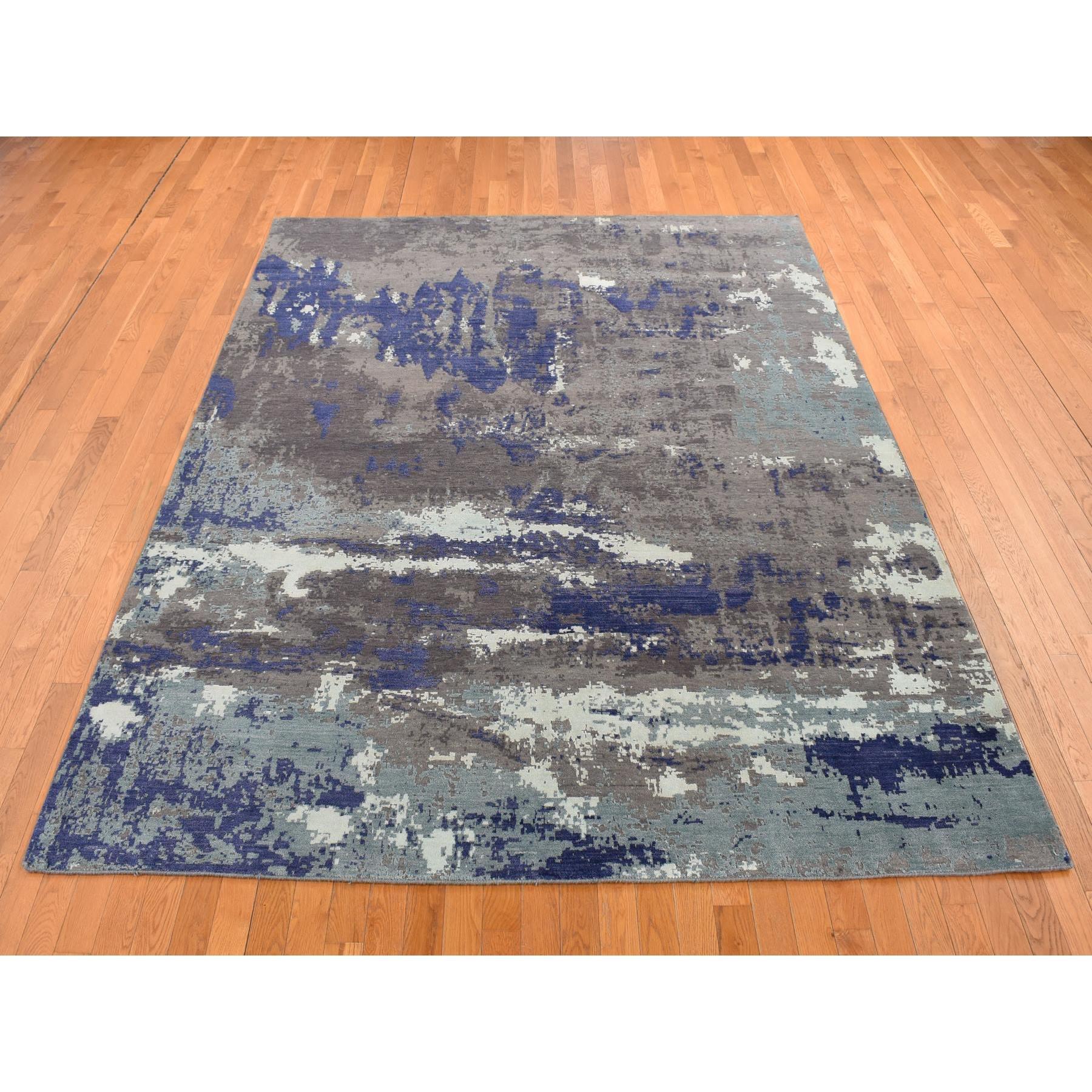 Ultra Violet Purple, Hand Knotted, Abstract Galaxy Design, Wool and Silk, Oriental Rug
Primary materials: Wool & Silk
Latex: No Pile 
height: 0.25 Inches
Style: Transitional
Primary color: Purple
Secondary colors: Light Blue, Ivory, Davy's
