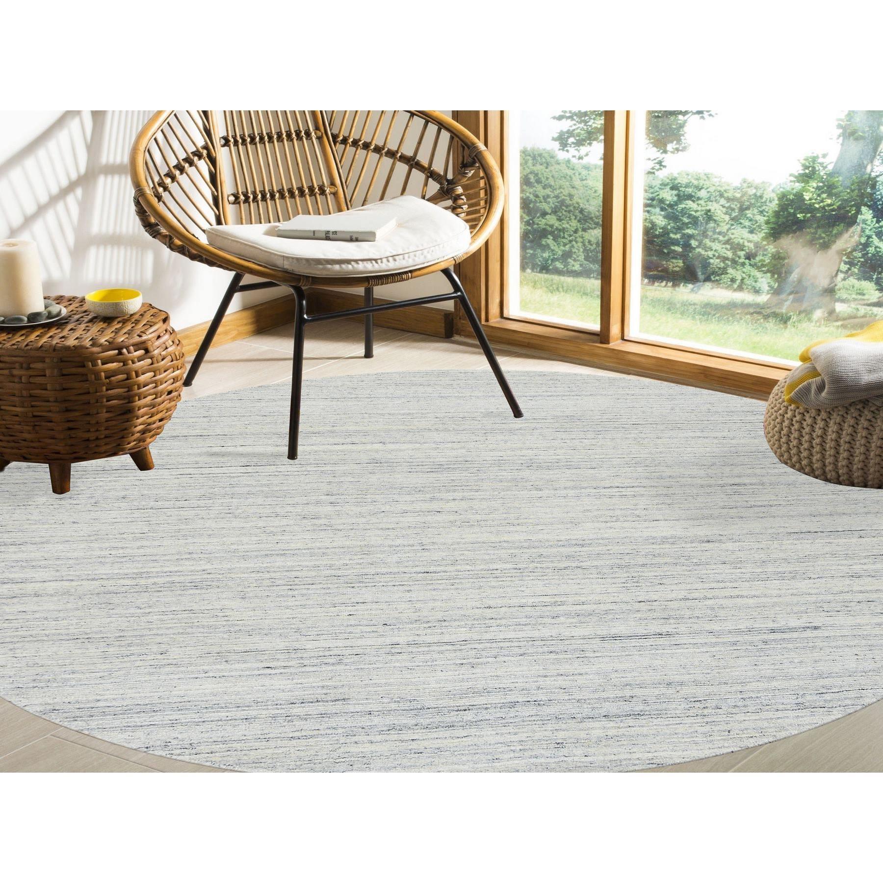 This is a truly genuine one-of-a-kind Ivory, Soft Pile Pure Wool Hand Loomed, Plain Modern Striae Design, Round Oriental Rug. It has been Loomed for months and months in the centuries-old weaving craftsmanship techniques by expert artisans.
Primary