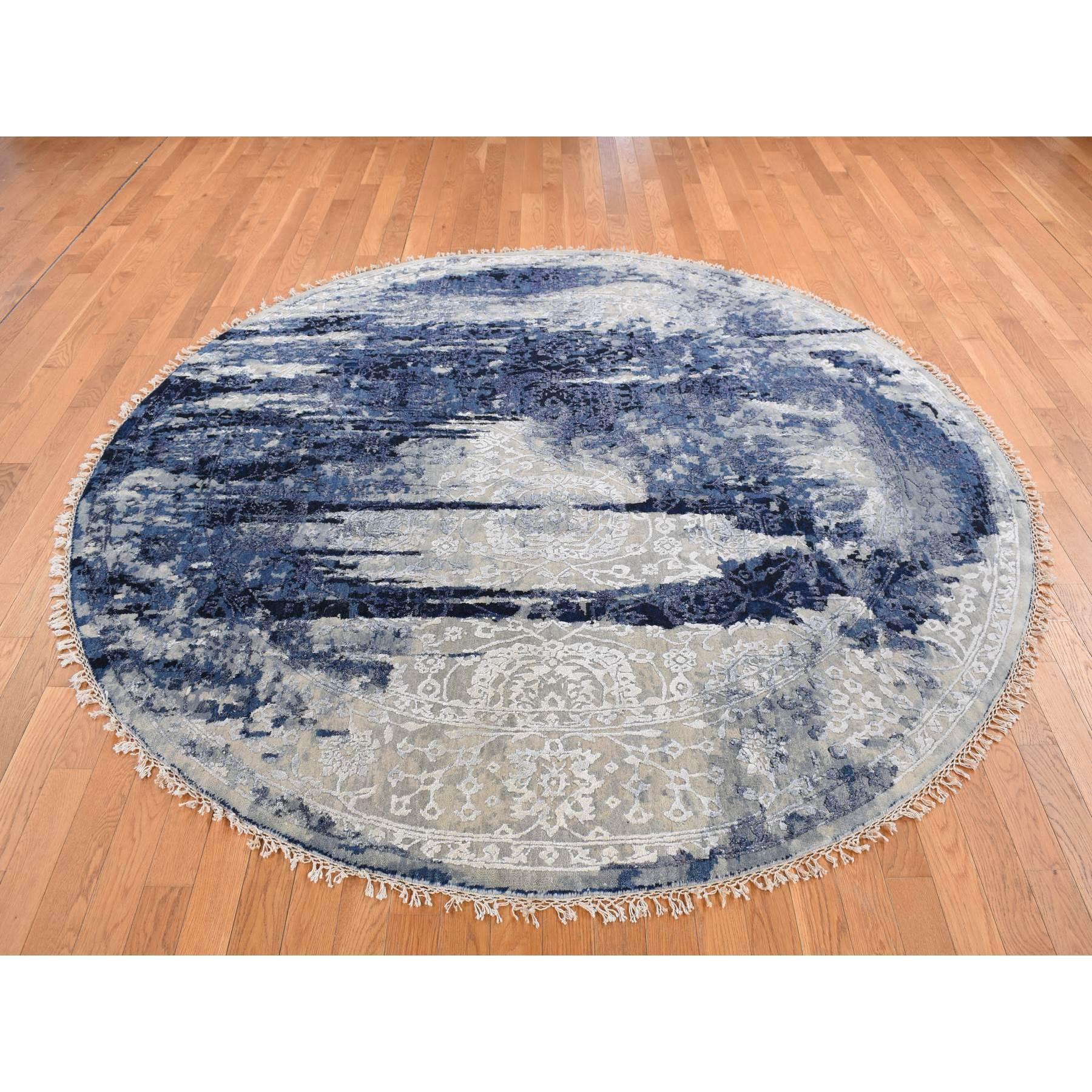 Millennium Blue, Wool and Silk, Shibori Design, Tone On Tone, Hand Knotted, Round Oriental Rug
Primary materials: Wool & Silk
Latex: No Pile 
height: 0.25 Inches
Style: Transitional
Primary color: Blue
Secondary colors: Ivory, Black, Taupe