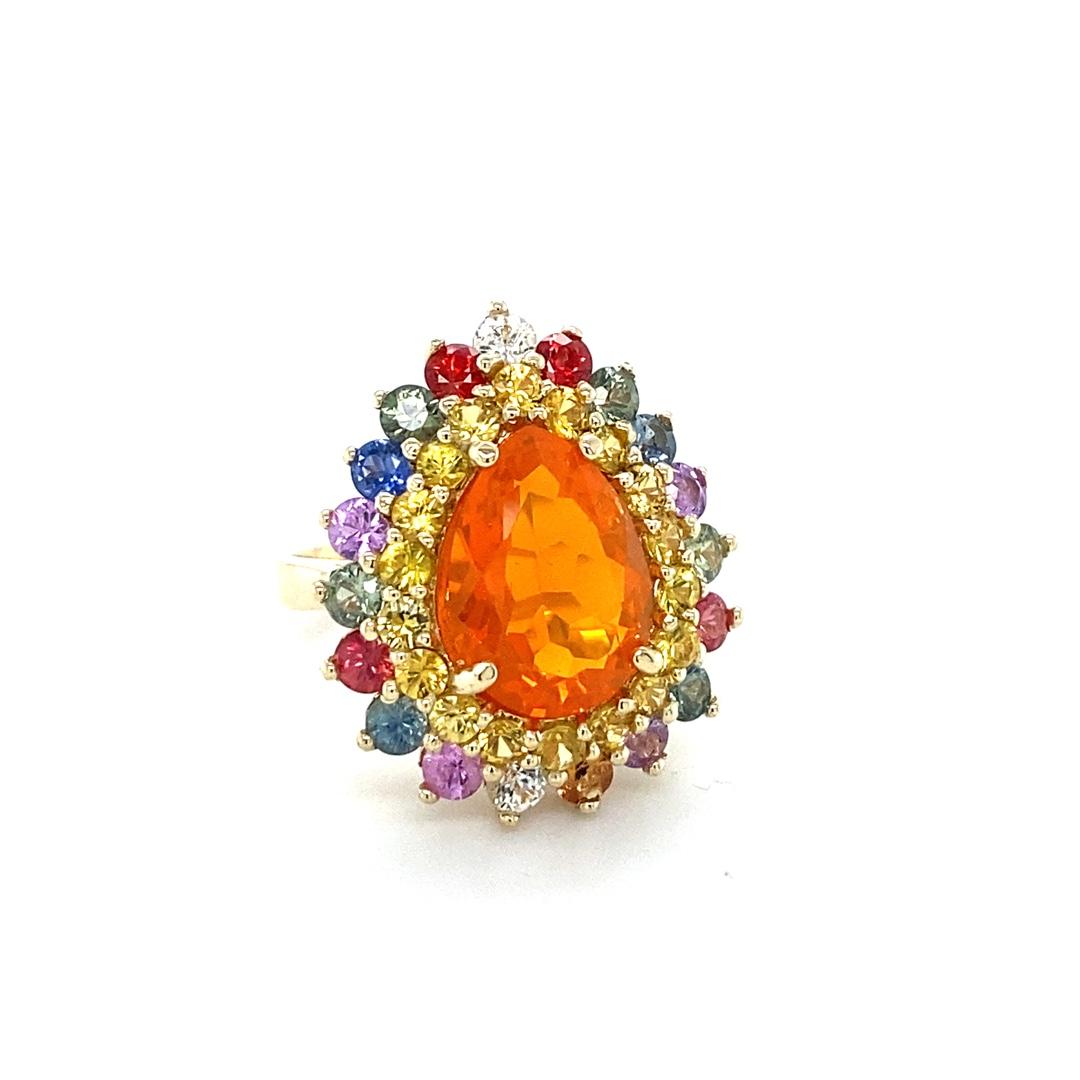 7.11 Carat Pear Cut Natural Fire Opal Sapphire Yellow Gold Cocktail Ring

Item Specs:

Natural Orange Fire Opal (Pear Cut) = 3.27 Carats
18 Natural Yellow Sapphires (Round Cut) = 1.32 Carats
20 Natural Multi-Color Sapphires (Round Cut) = 2.52