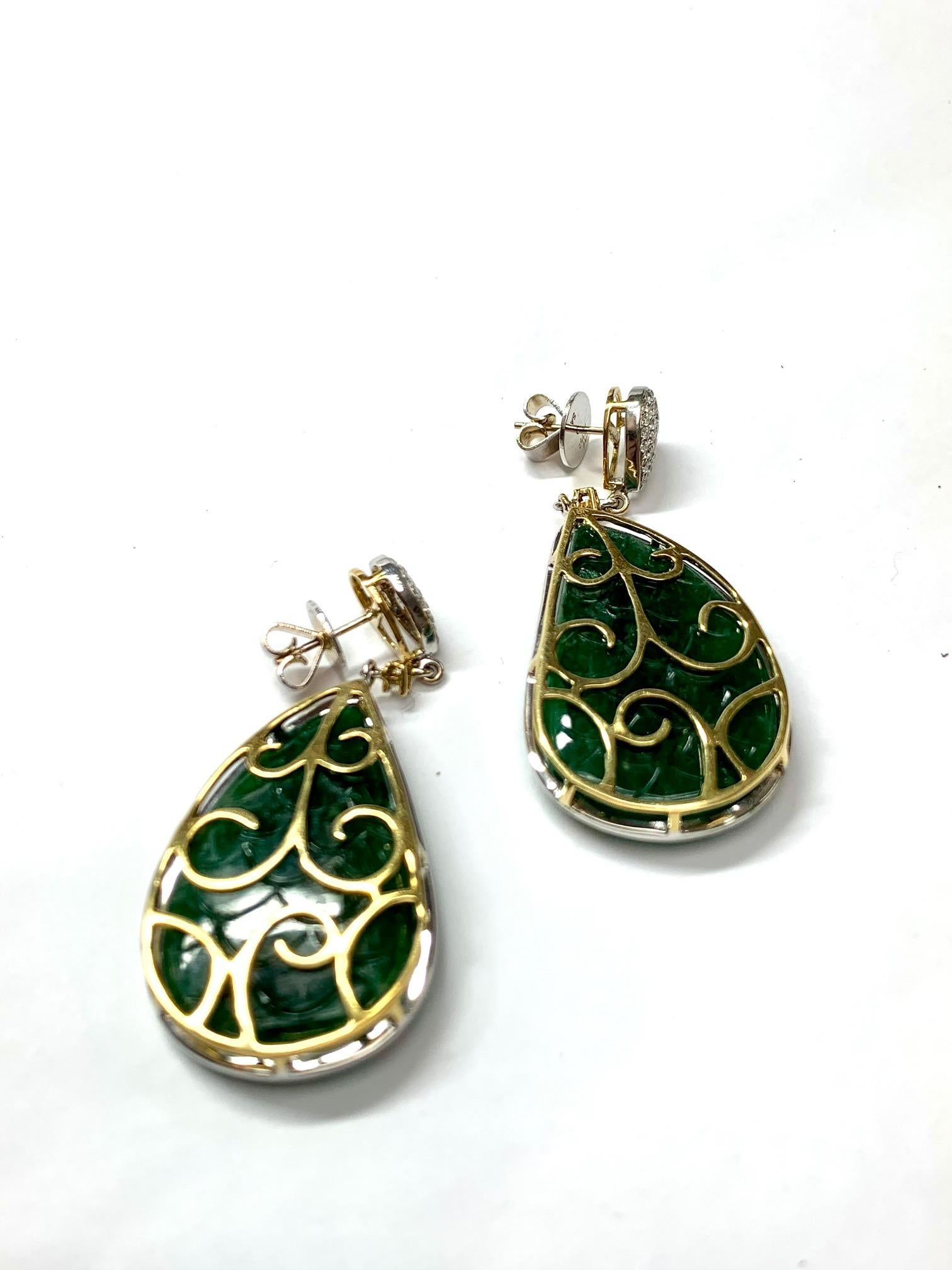 Pear Cut 71.16 Carat Carved Emerald Drop Diamond Earrrings For Sale