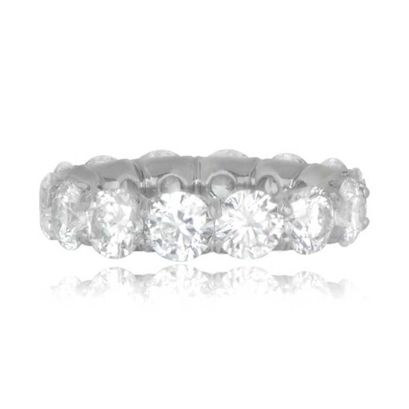 A stunning platinum eternity band adorned with 7.11 carats of round brilliant cut diamonds. Each diamond boasts approximately 0.50 carats, showcasing a G/H color and VS2 clarity.

The diamonds are elegantly set in a shared prong setting, creating a