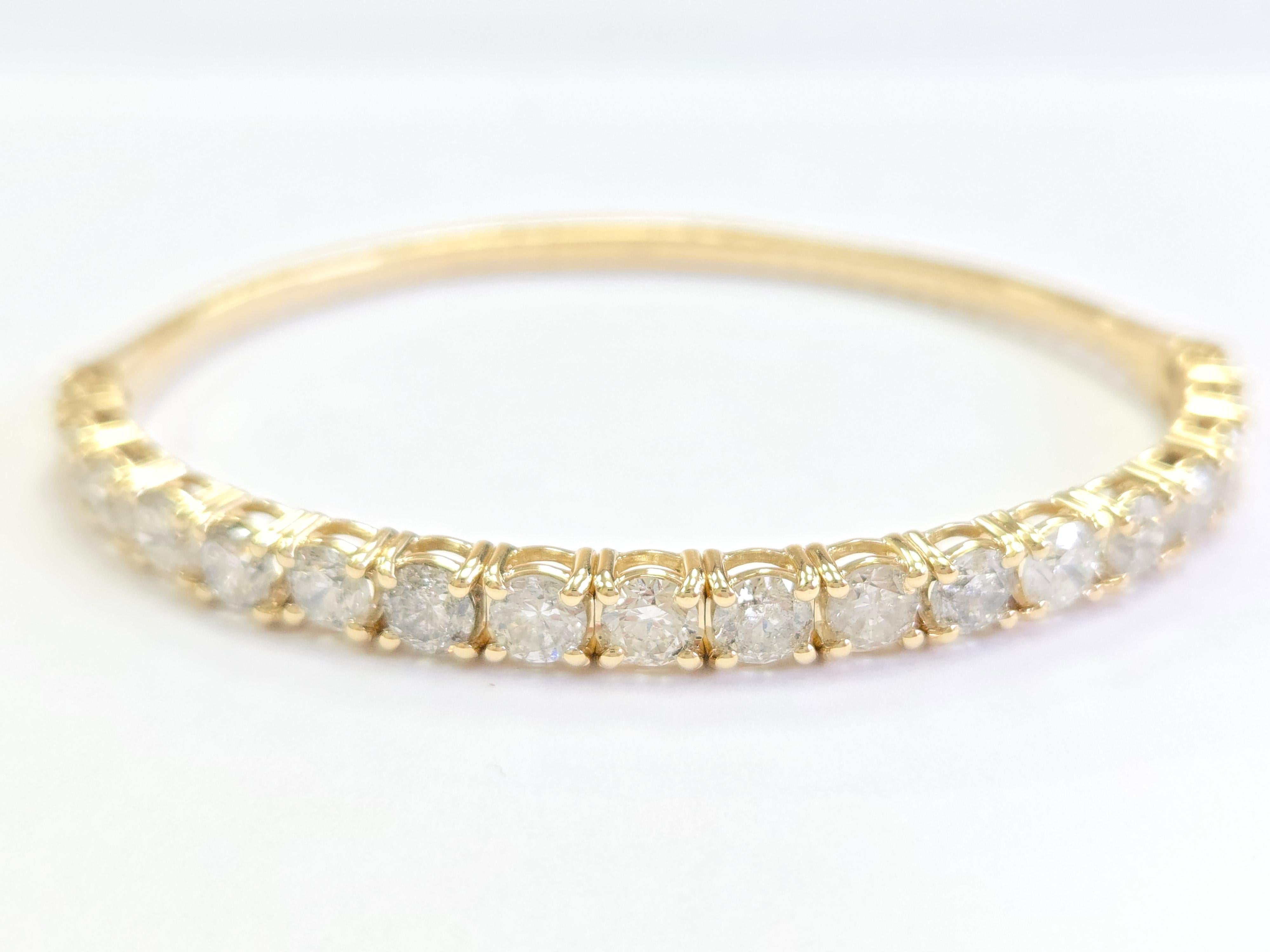 7.12 Carat Flexible Half Way Bangle with Natural Diamonds

Diamond Carat Weight: 7.12 carats
Gold: 14K Solid Yellow Gold
Length: 7 inches
Diamond Average Color: G
Diamond Average Clarity: I1
Width: 5 mm 
It’s a beautiful piece, especially with the