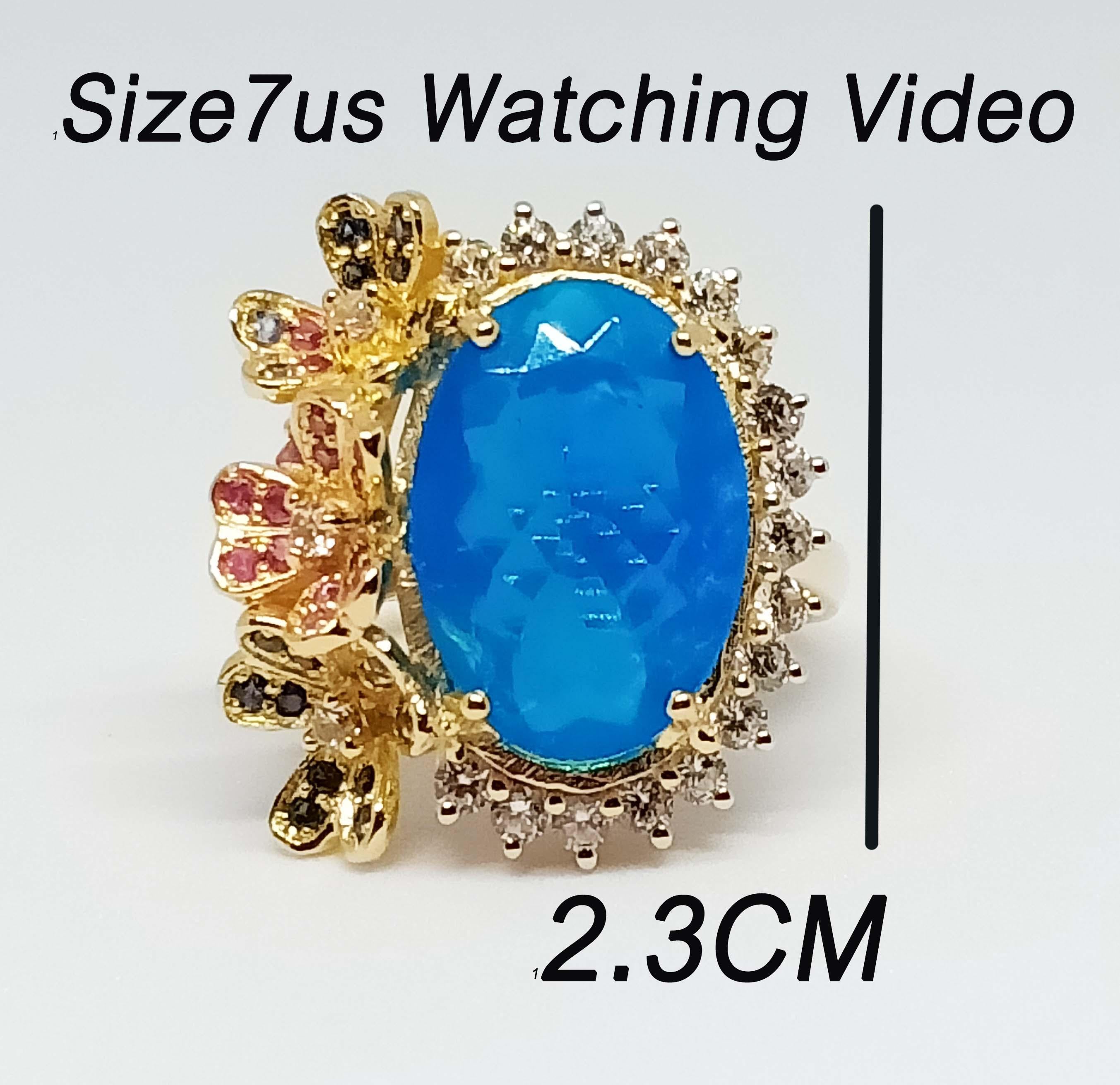 Blue Opal Oval 16.4x11.5 mm. 7.12 cts
Blue Sapphire 1.20 mm. 22 pcs.
Pink Sapphire 1.20 mm. 14 pcs.
Pink Sapphire 3.0 mm. 2 pcs.
White Zircon 2 mm. 20 pcs.
Sterling Silver in 18 K Gold Plated.
Ring Size 7 US



