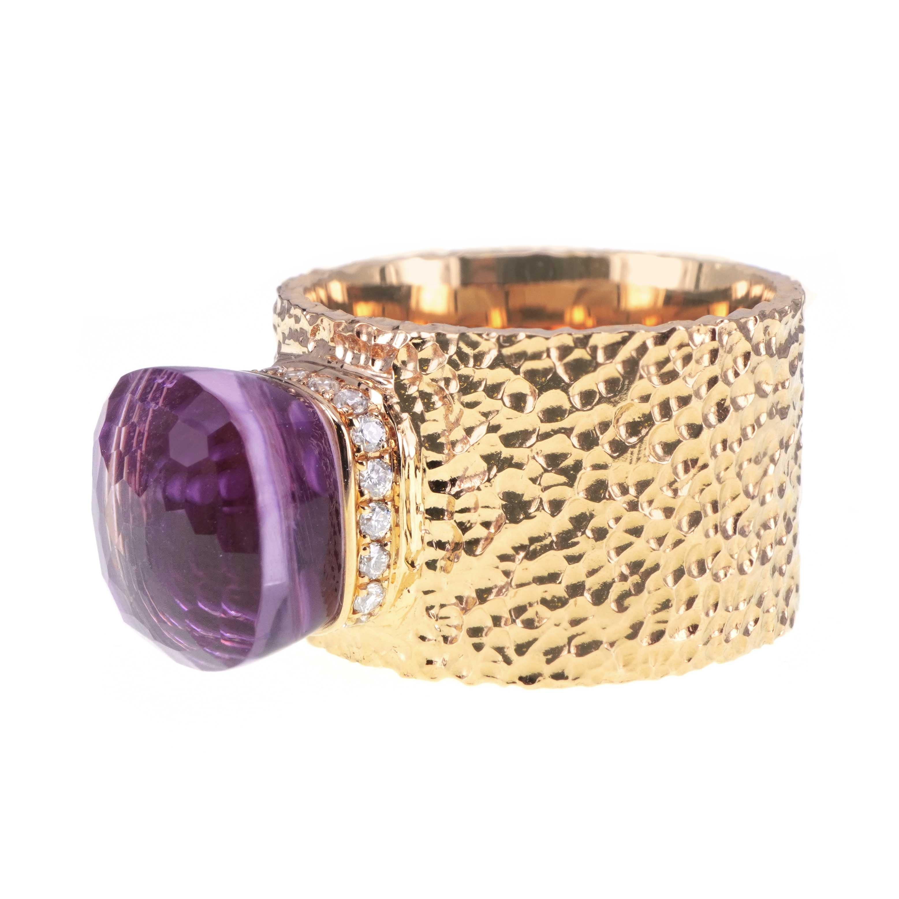 A quirky cut of Amethyst is set on with 0.19 carats of white diamond round brilliant diamond. The ring is made in heavy 18 K Gold and is hand made in Hong Kong. The design of the ring is inspired by the Magic Lamp of the Genie, and thus its shows