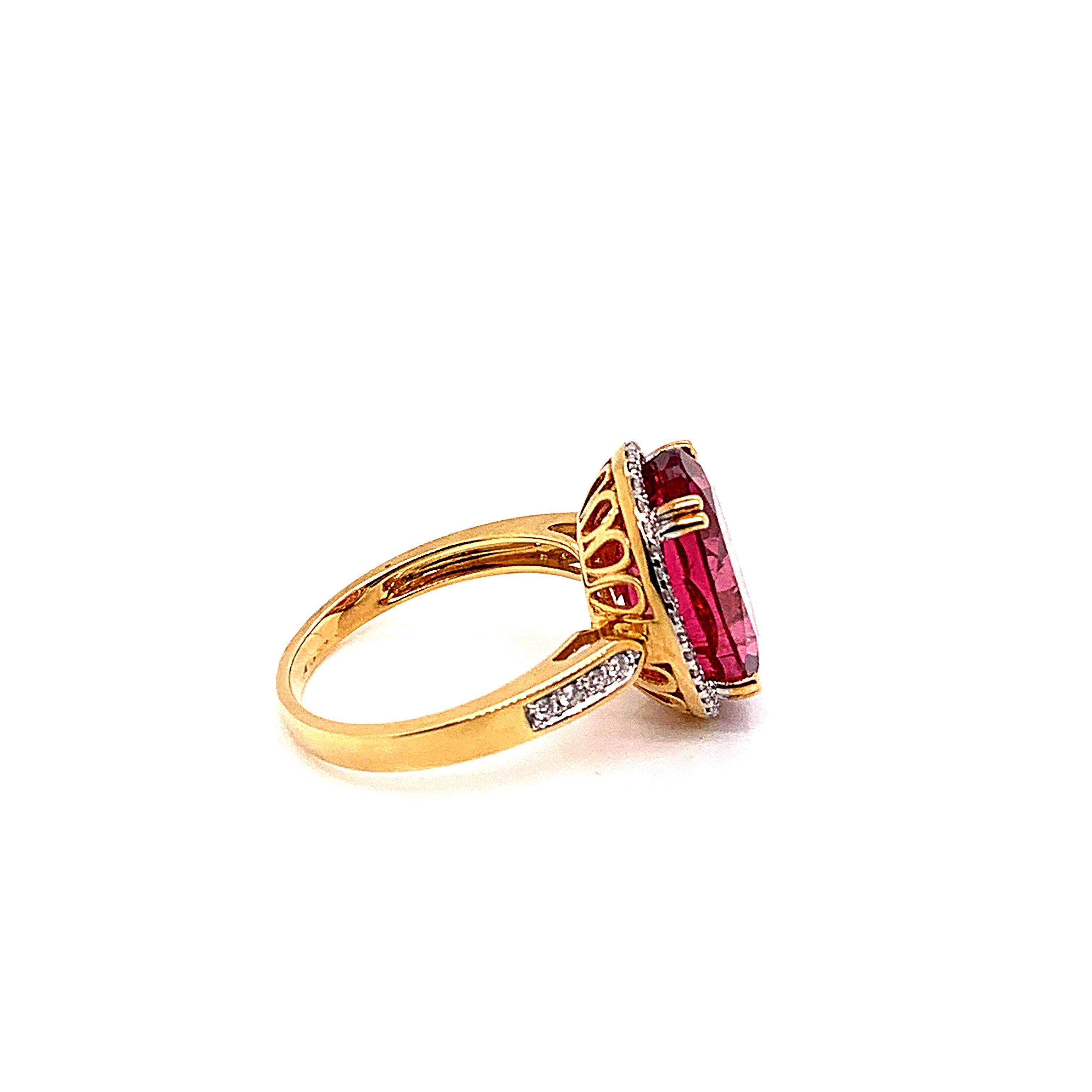 Contemporary 7.13 Carat Oval Shaped Rubelite Ring in 18 Karat Yellow Gold with Diamonds For Sale