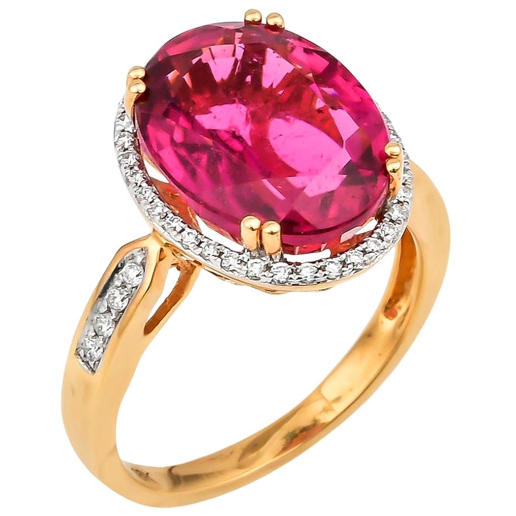 7.13 Carat Oval Shaped Rubelite Ring in 18 Karat Yellow Gold with Diamonds For Sale