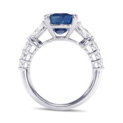 7.13 cts Certified Royal Blue Oval Sapphire and Diamond Side-stone Ring